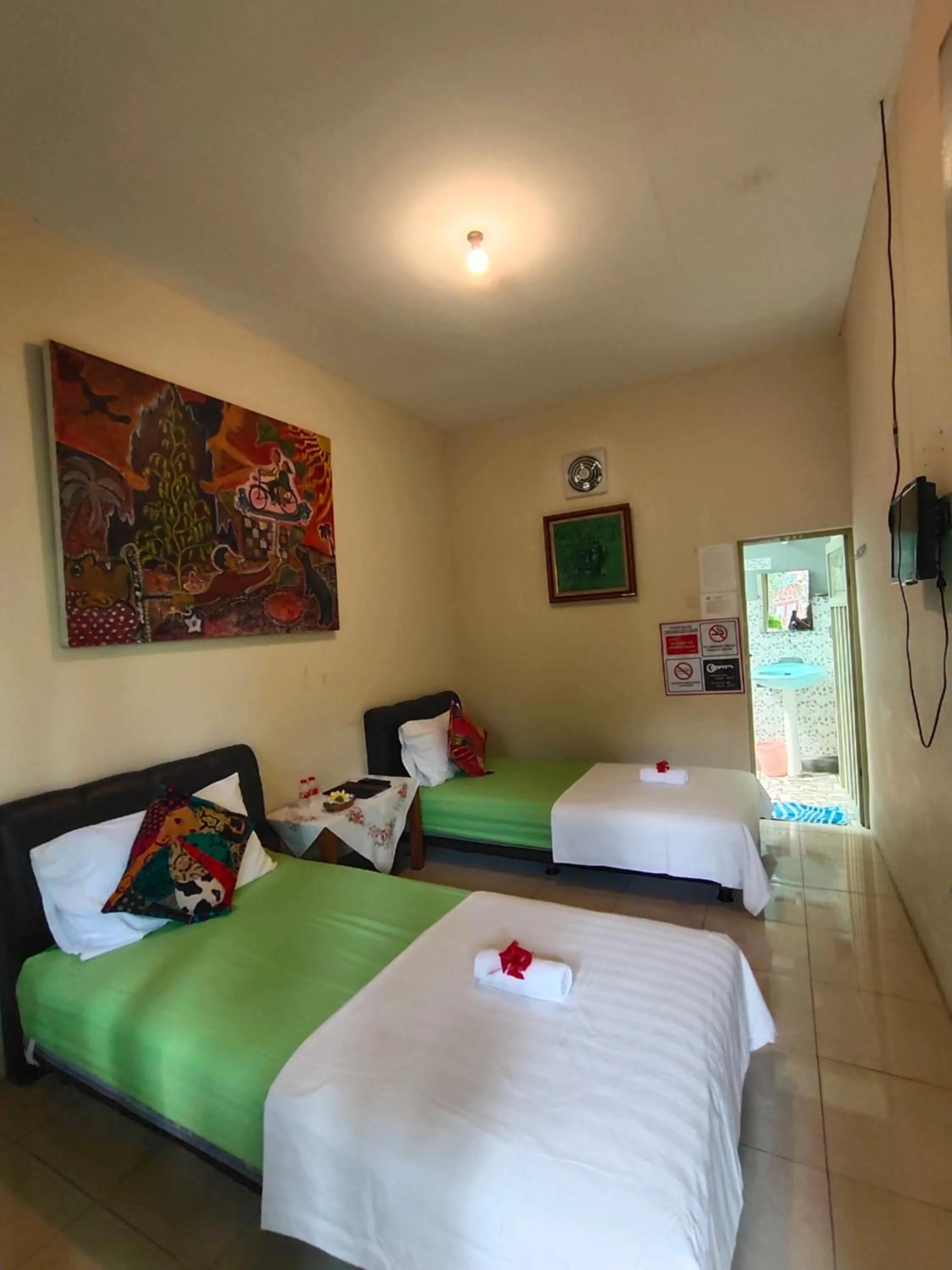 Bed in Mettaloka Guesthouse