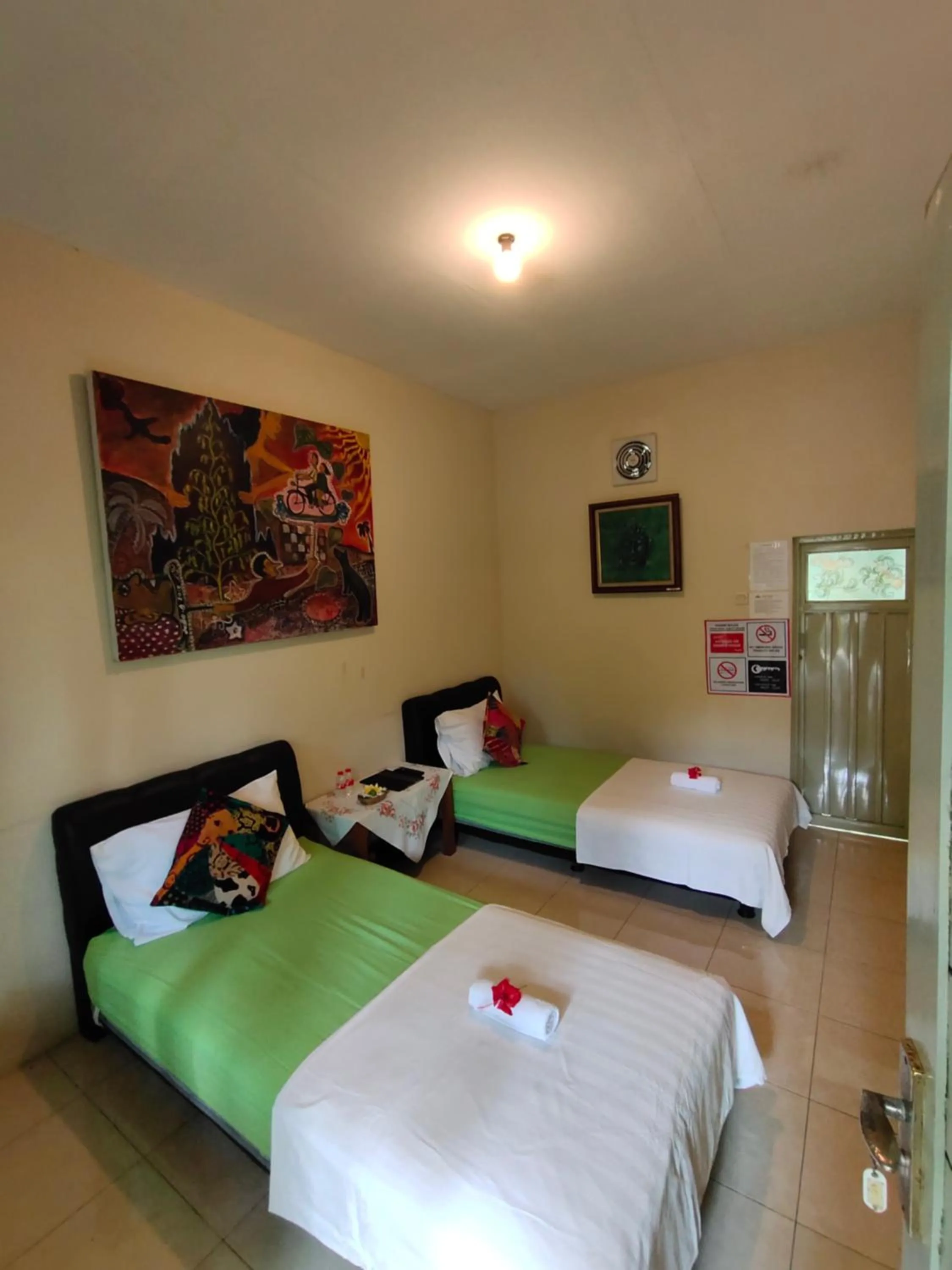 Bed in Mettaloka Guesthouse