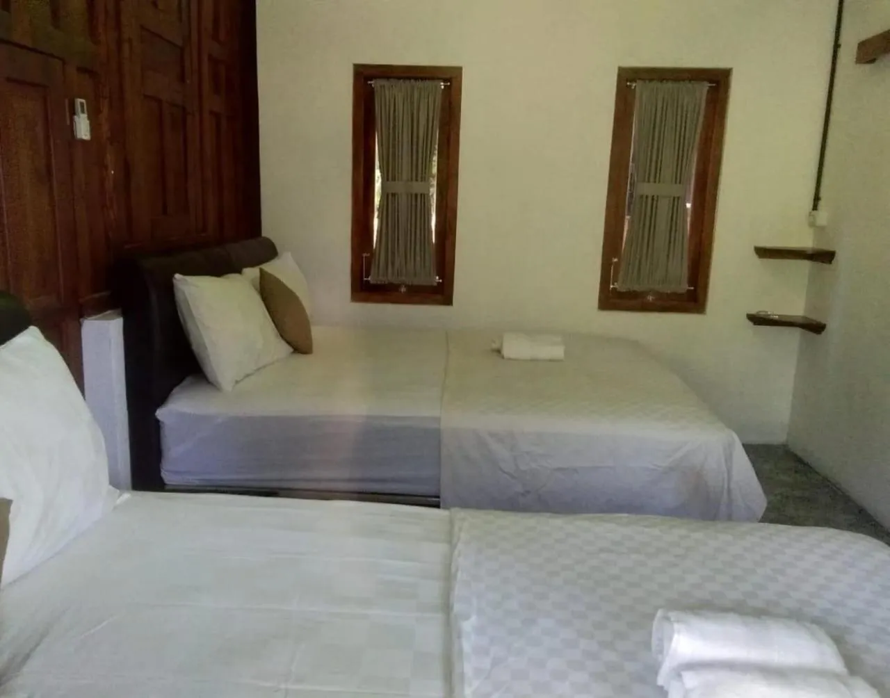 Bed in Mettaloka Guesthouse