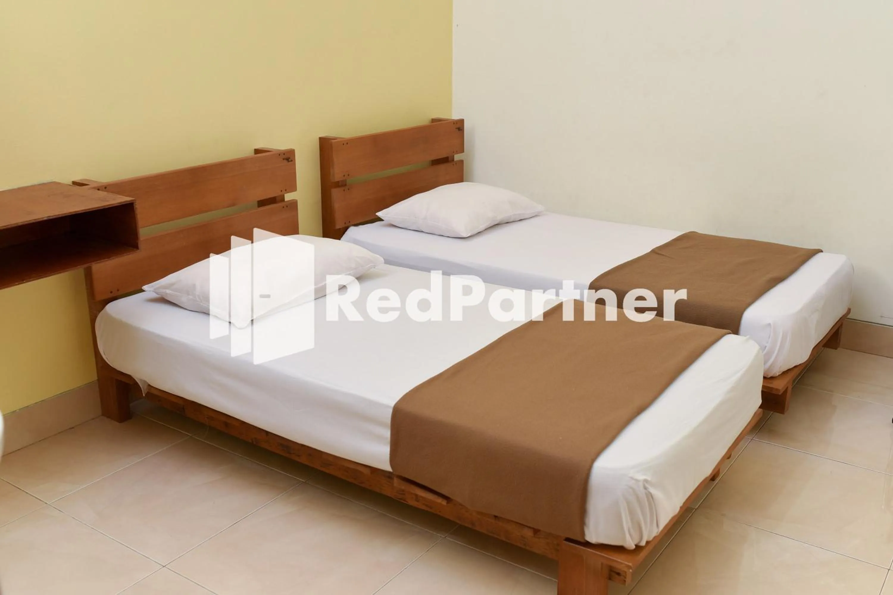 Bed in Homestay Rumah Citra Indah Syariah Mitra RedDoorz