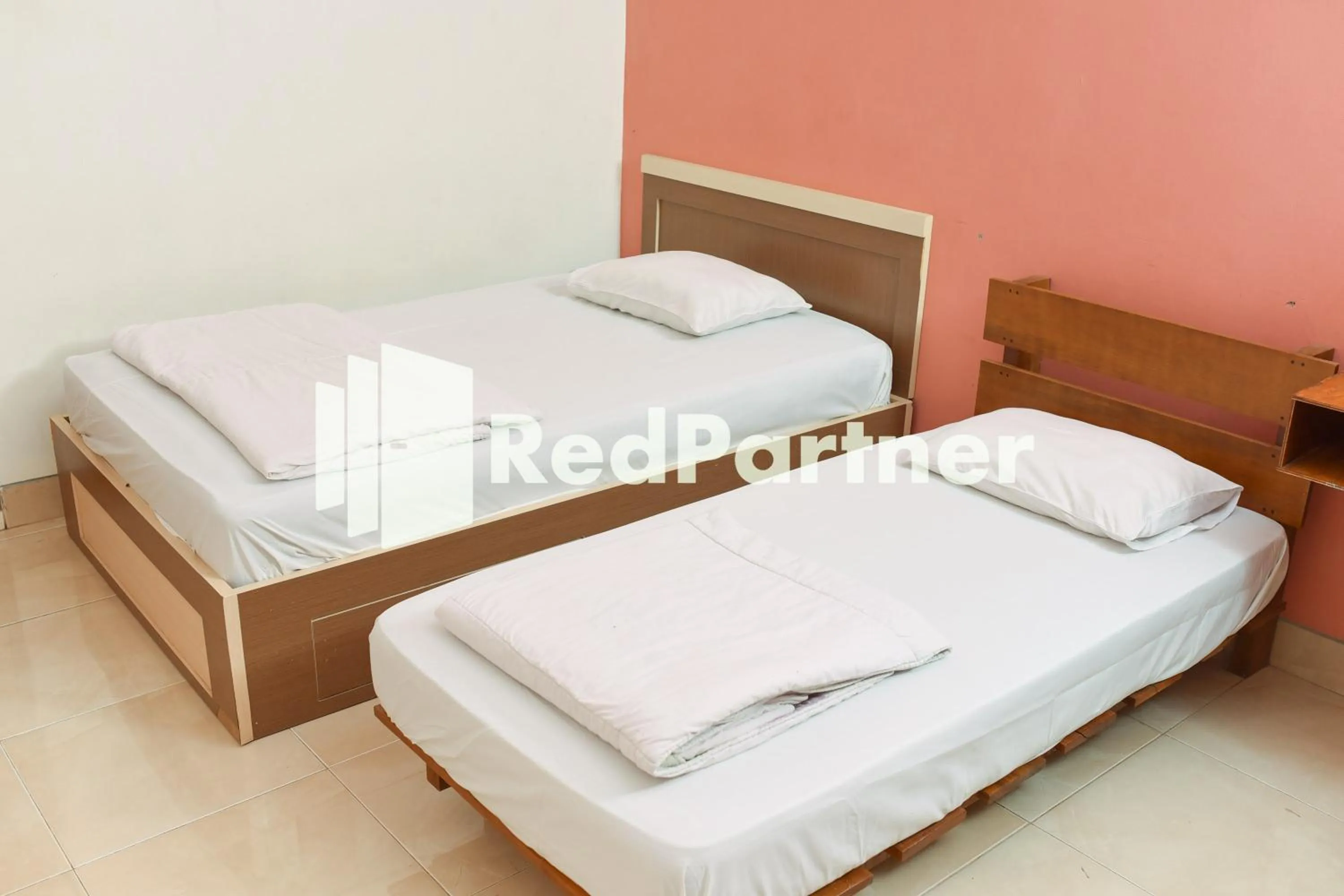 Bed in Homestay Rumah Citra Indah Syariah Mitra RedDoorz