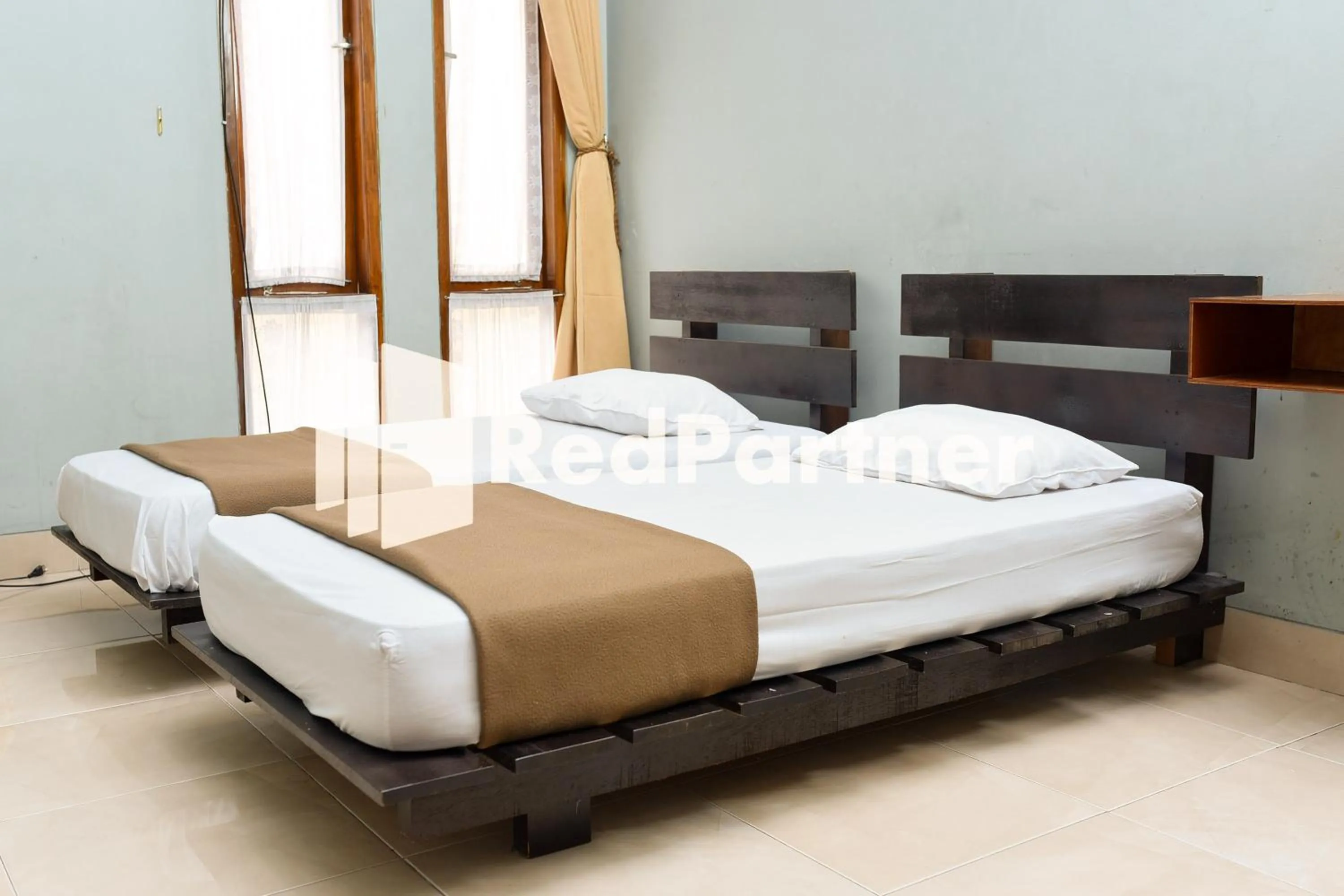 Bed in Homestay Rumah Citra Indah Syariah Mitra RedDoorz