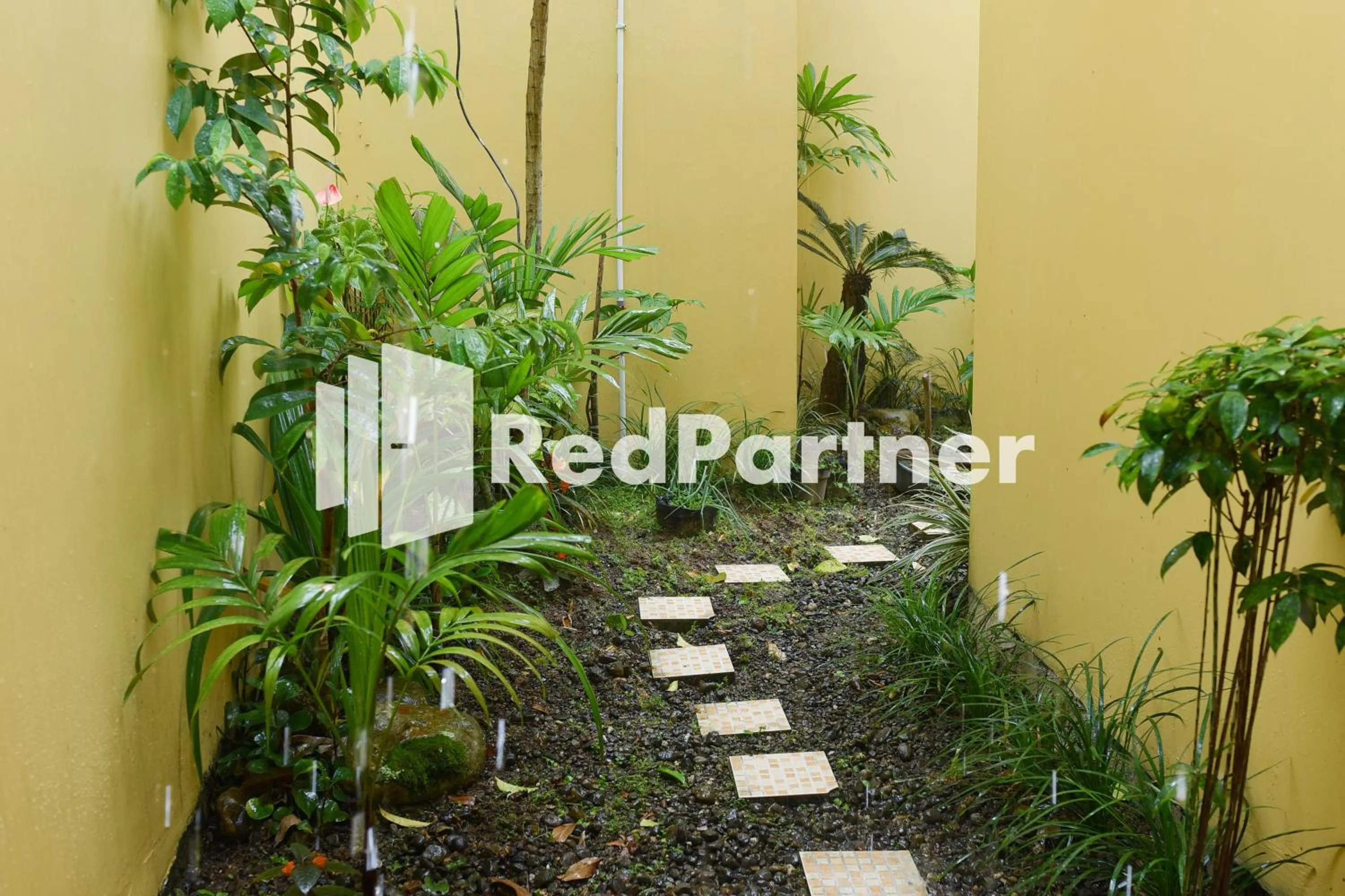 Garden in Homestay Rumah Citra Indah Syariah Mitra RedDoorz