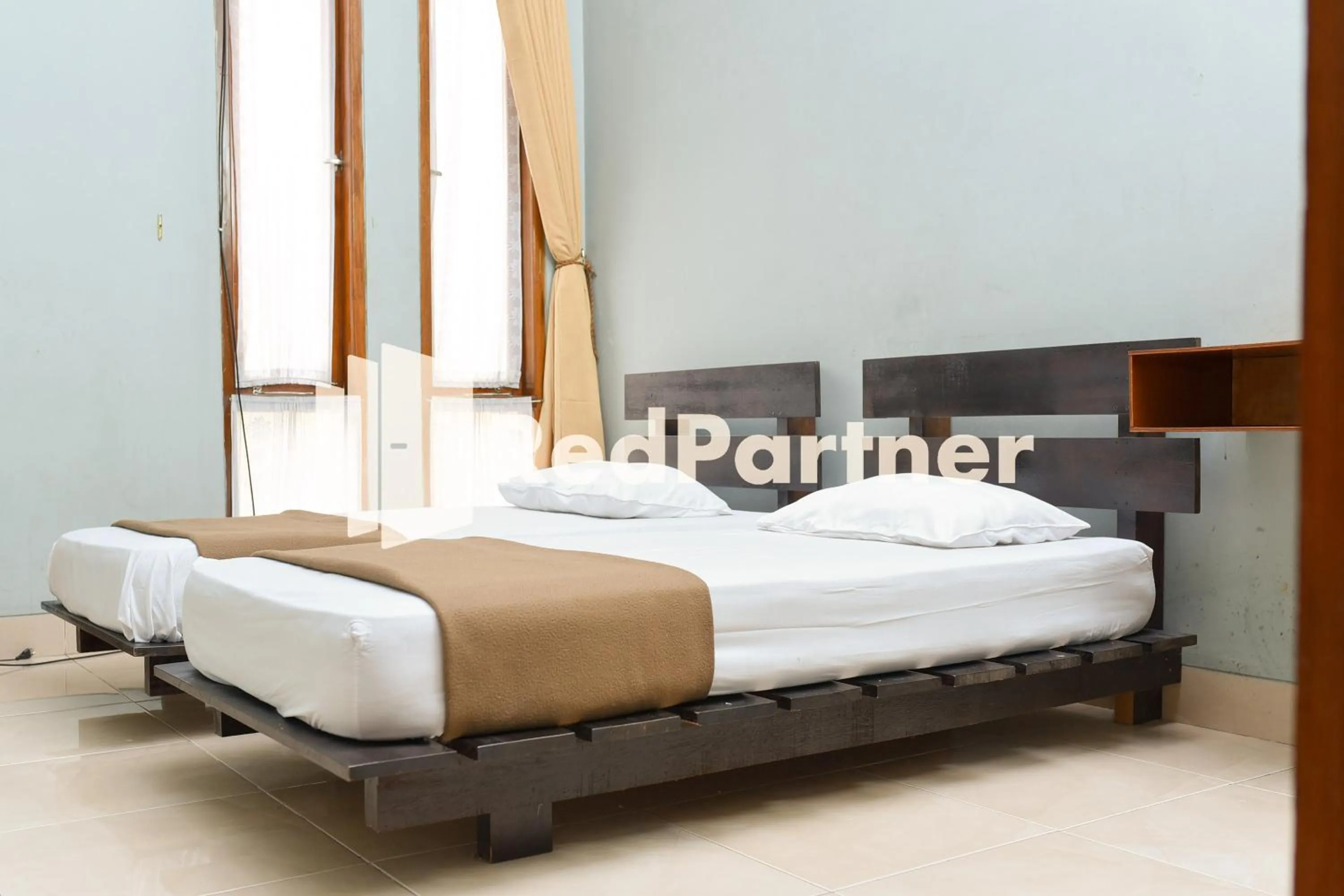 Bed in Homestay Rumah Citra Indah Syariah Mitra RedDoorz