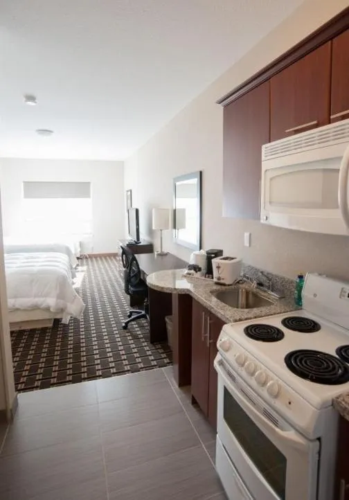 Living room, Bed in Western Star Inn and Suites Carlyle