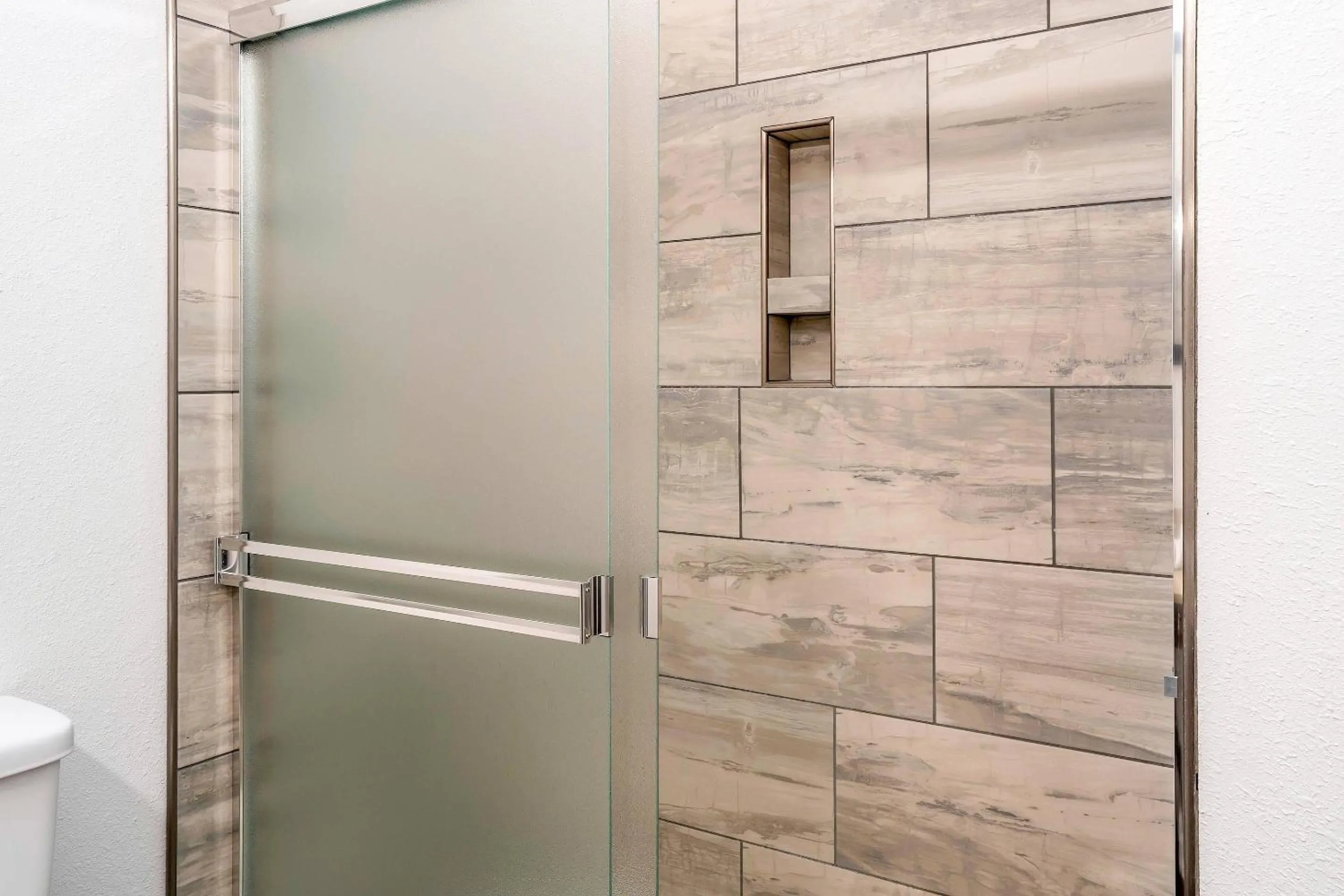 Bedroom in Riverview Inn & Suites, an Ascend Collection Hotel