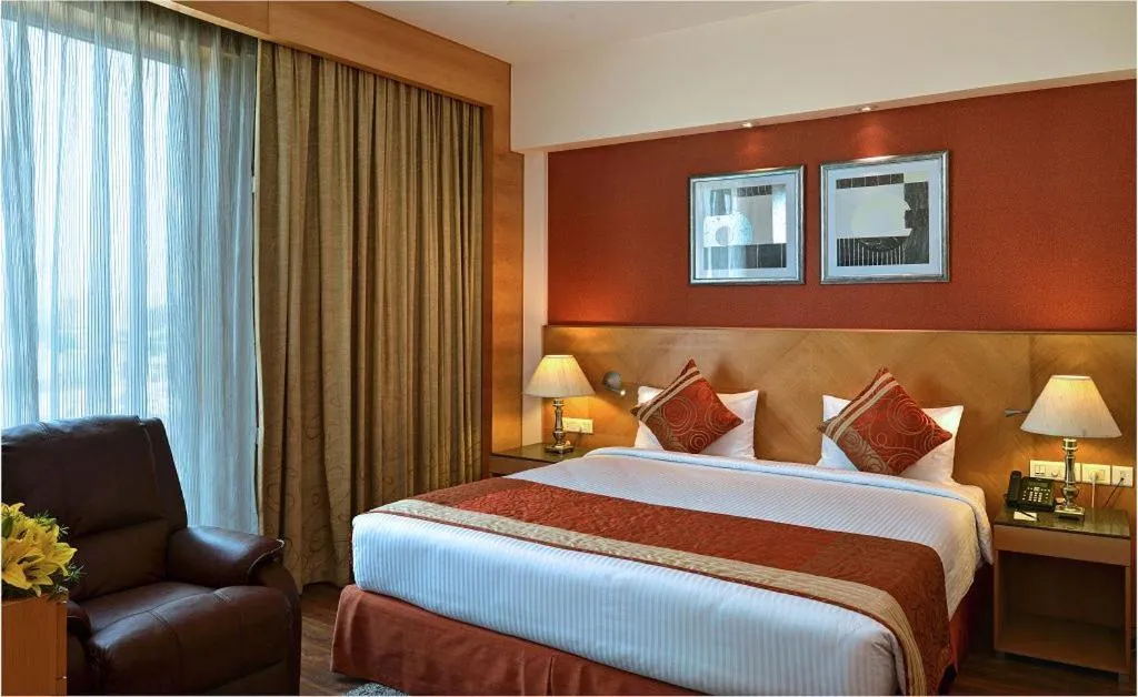 Bed in Savoy Suites Manesar