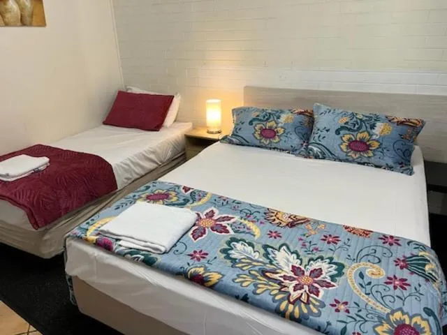 Bed in Paradise Motel