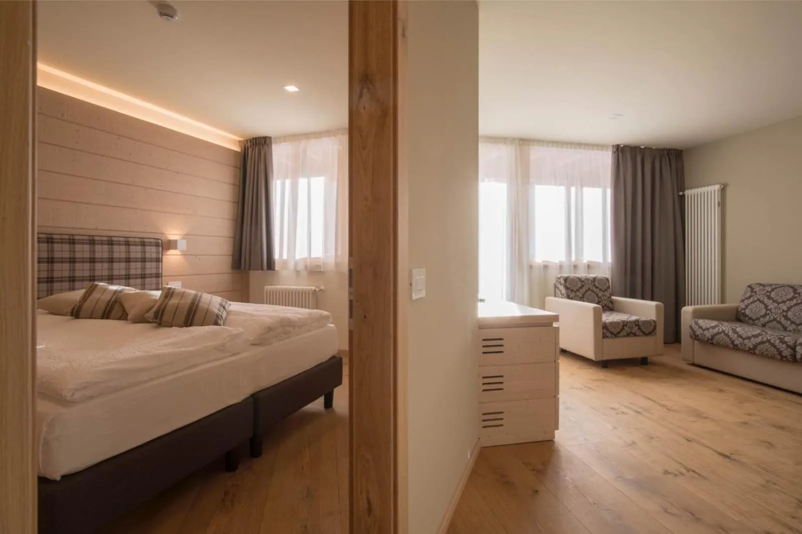 Living room, Bed in Hotel La Baita