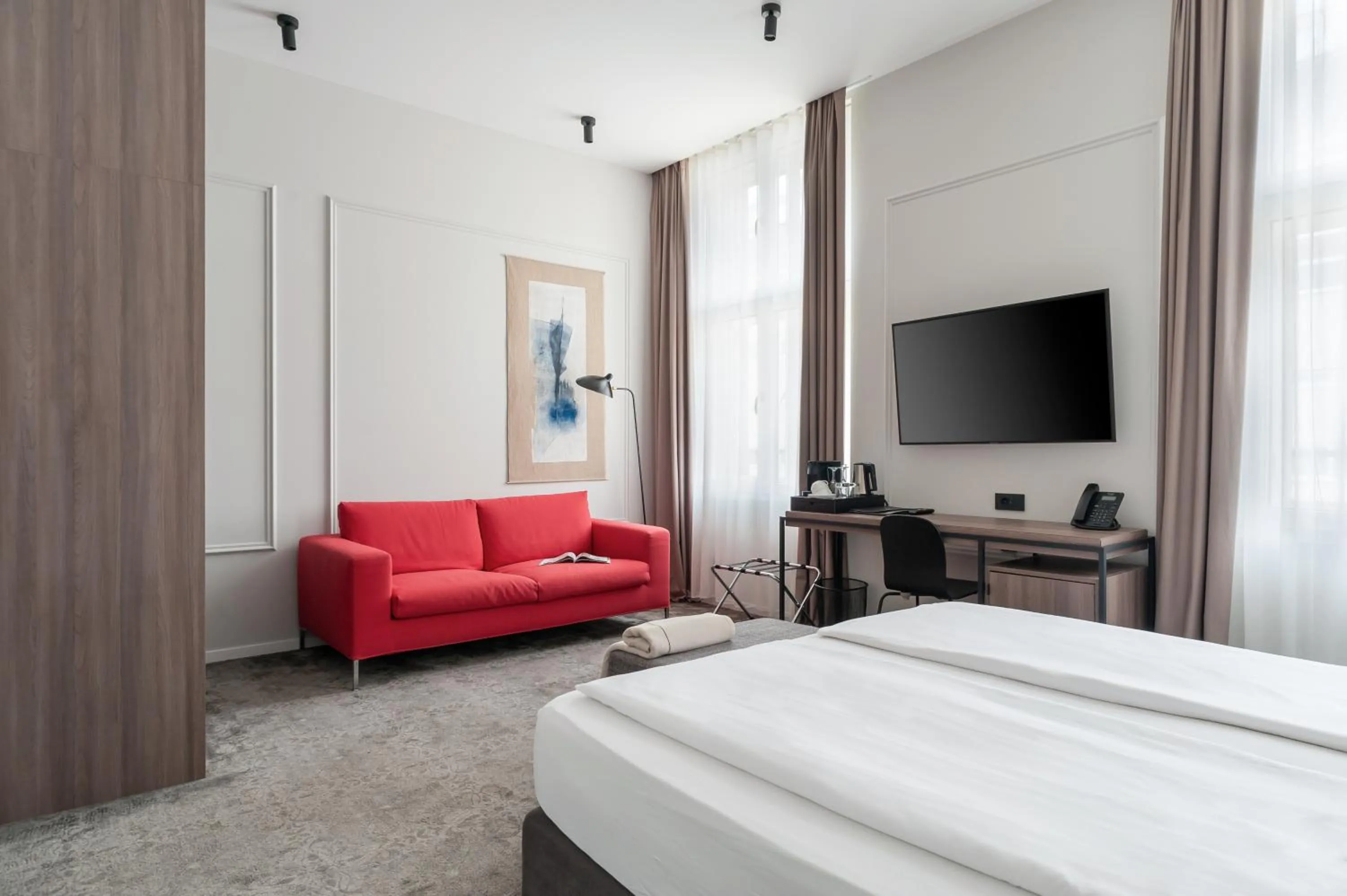 Seating area, Bed in MANDA Heritage Hotel