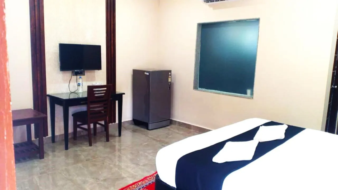 Bed in Sea Shell Beach Cottages & Suites