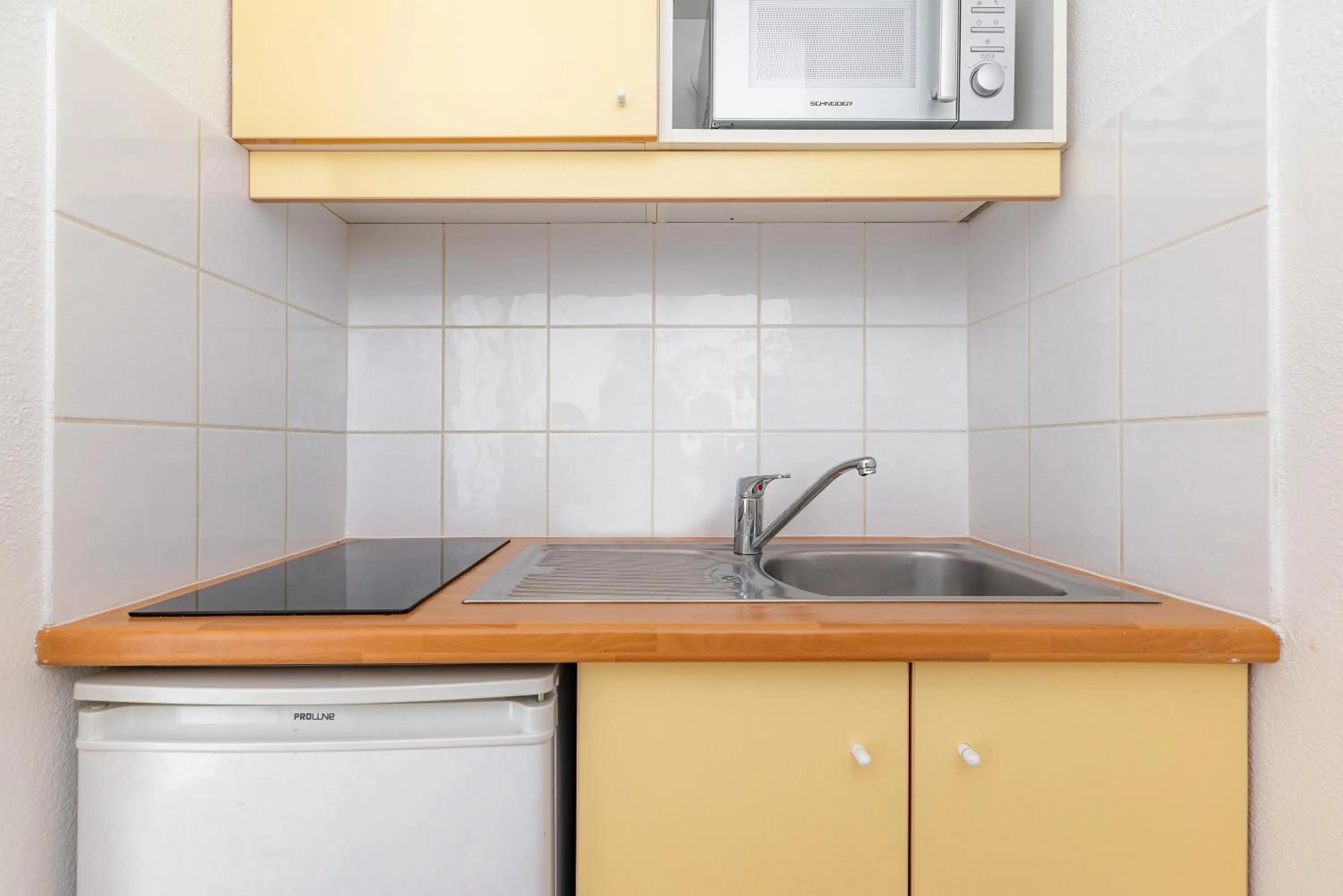 Kitchen or kitchenette in Appart'City Classic Dijon - Toison D'Or