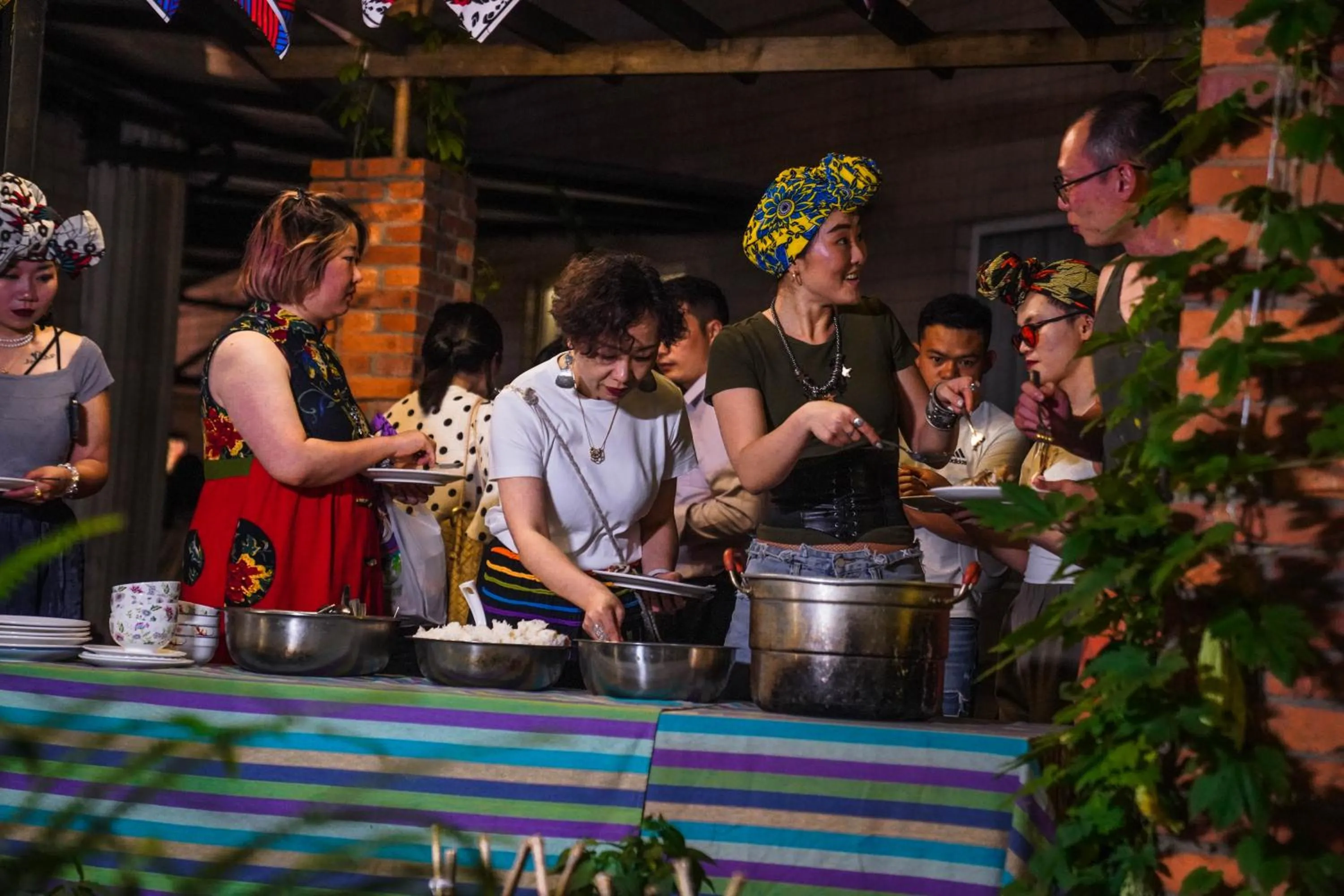 group of guests in Chengdu Local Tea Hostel - Short Walk To Taikooli - Chill & Social Coffee Lounge - Metro downstairs - Free Activities - Friendly English Speaking Staff - Tibet, Panda, Buddha & Snow Mountain Tours