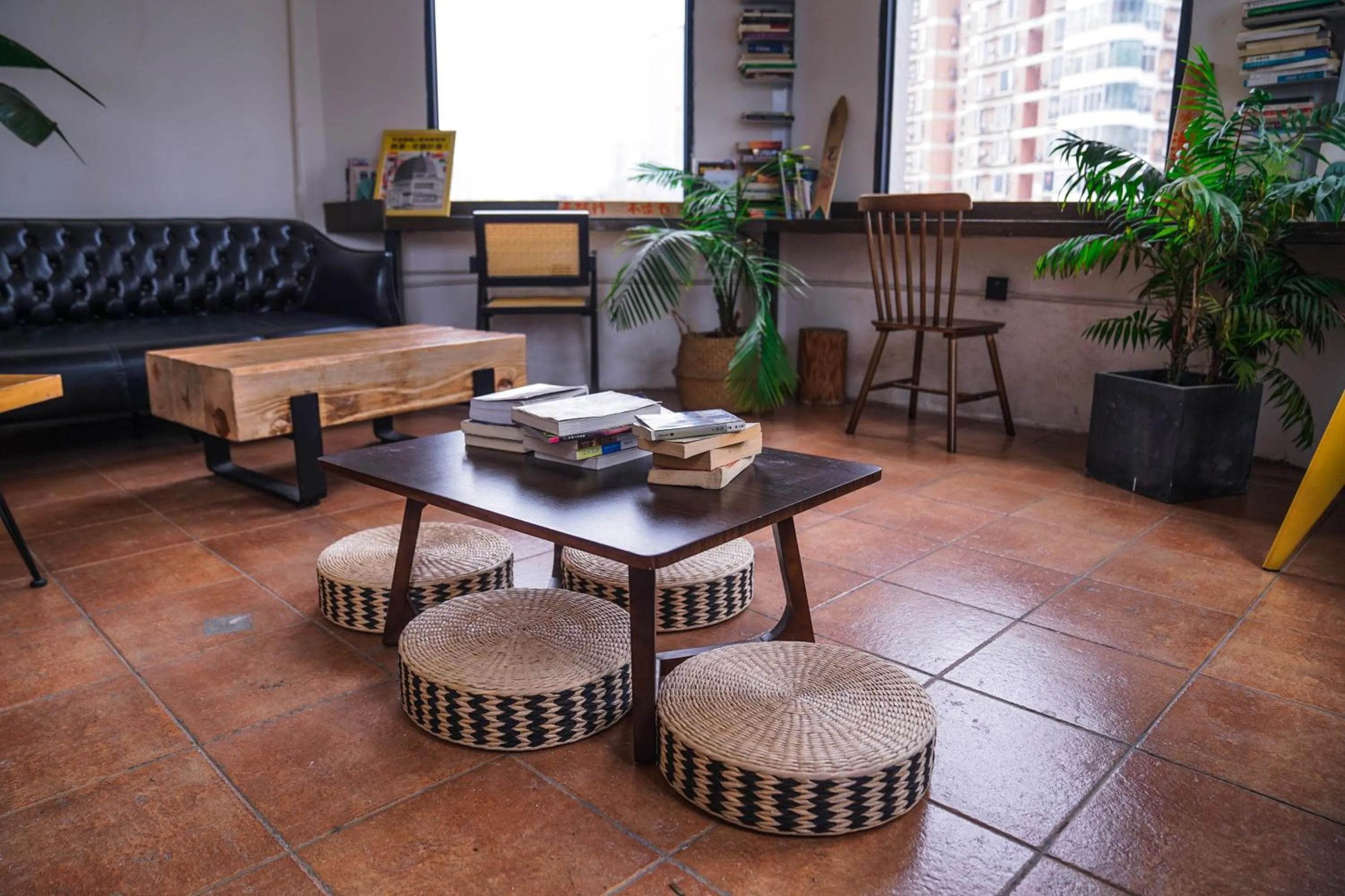 Seating area in Chengdu Local Tea Hostel - Short Walk To Taikooli - Chill & Social Coffee Lounge - Metro downstairs - Free Activities - Friendly English Speaking Staff - Tibet, Panda, Buddha & Snow Mountain Tours