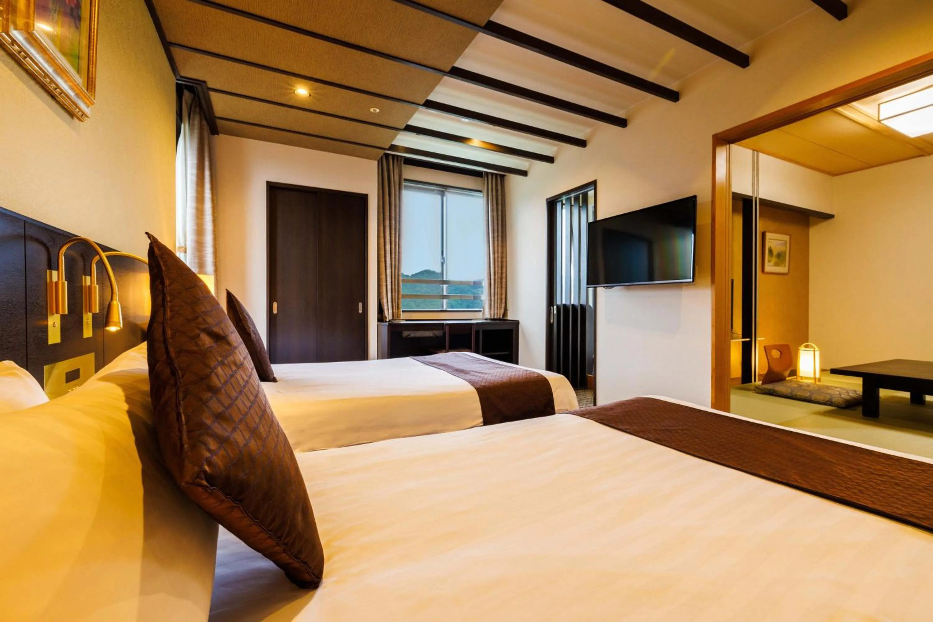 Photo of the whole room, Bed in KAMENOI HOTEL Nagatoro Yorii