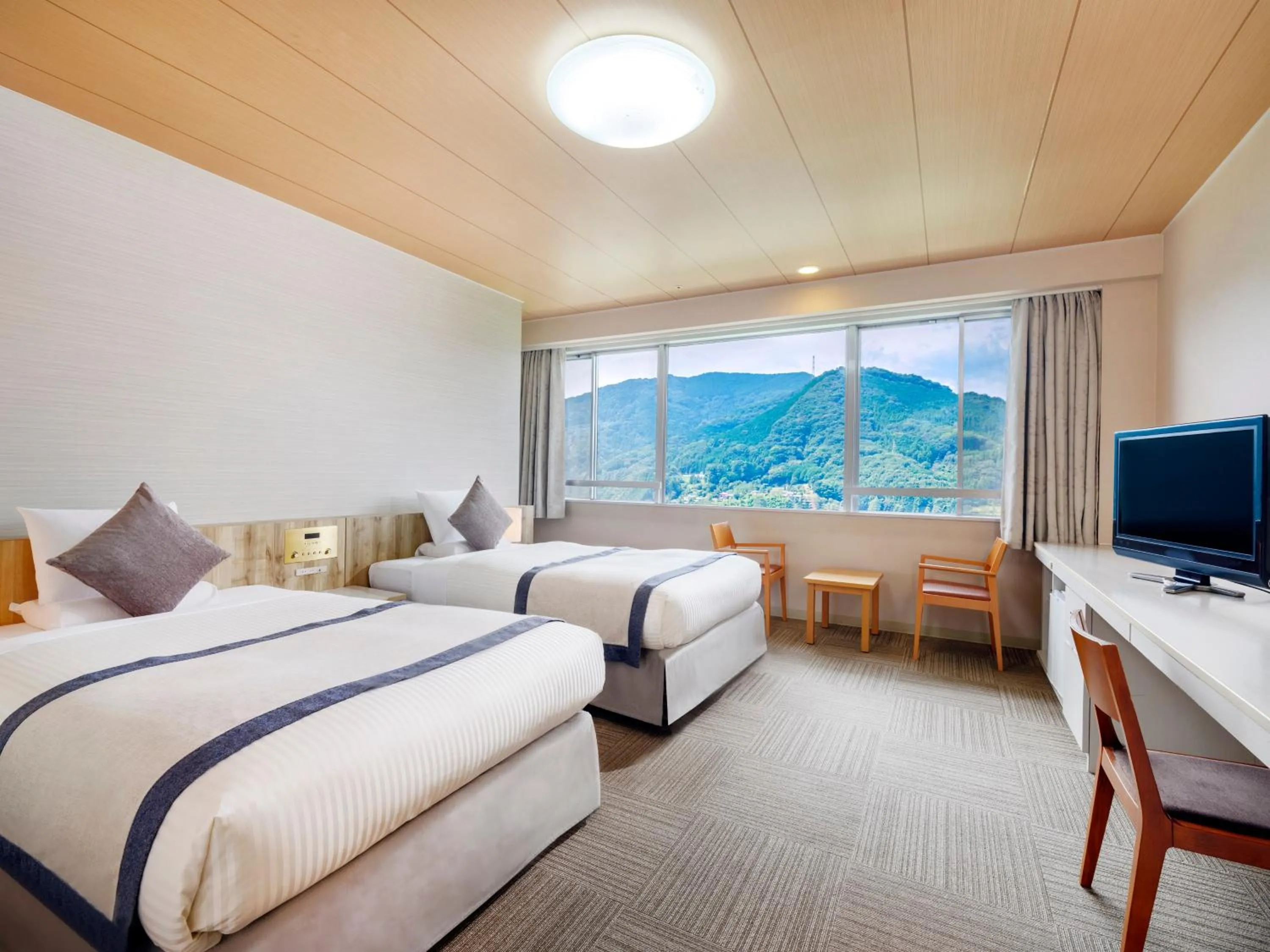 Bed in KAMENOI HOTEL Nagatoro Yorii