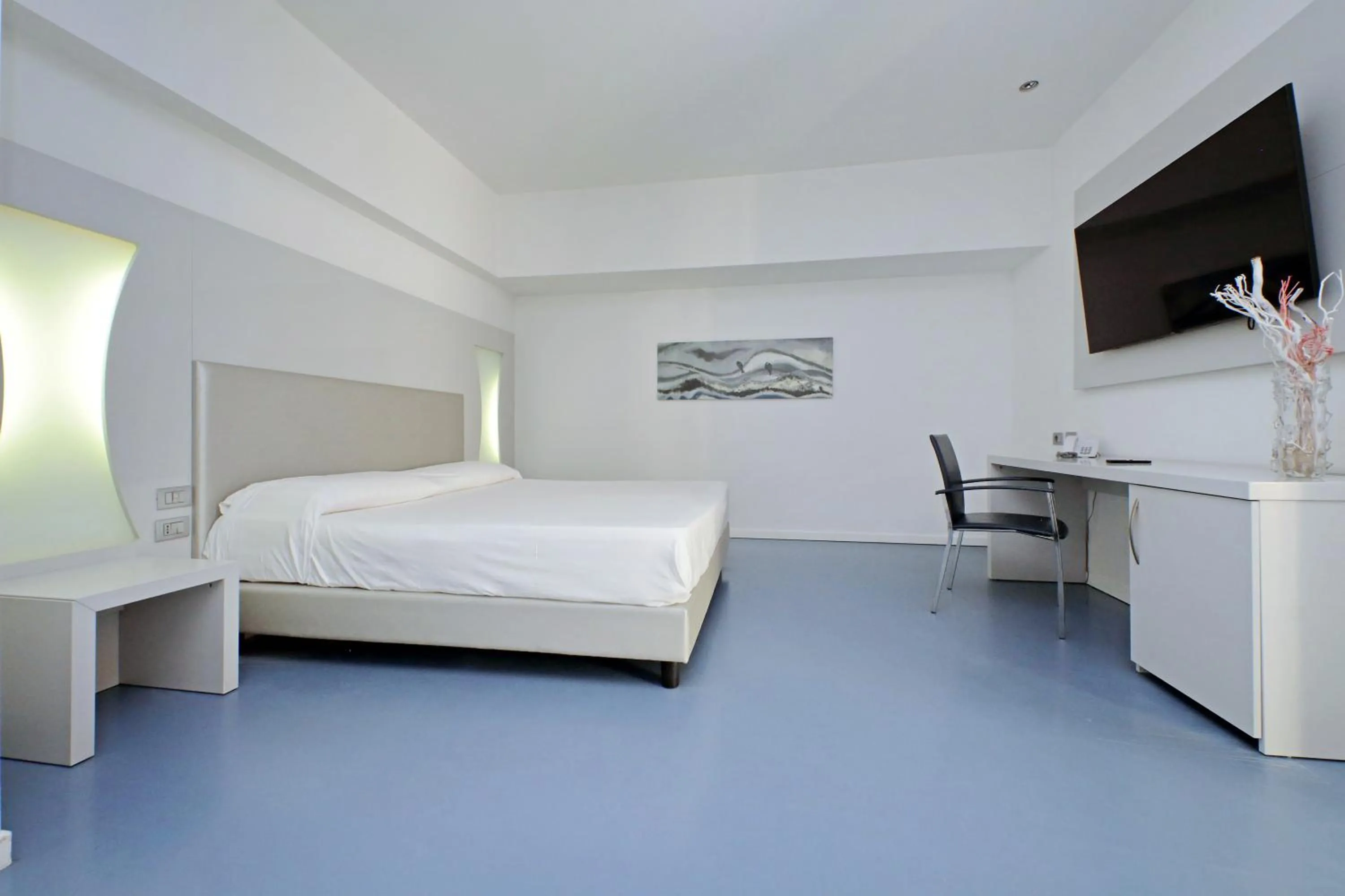 Bed in Hotel Poseidon