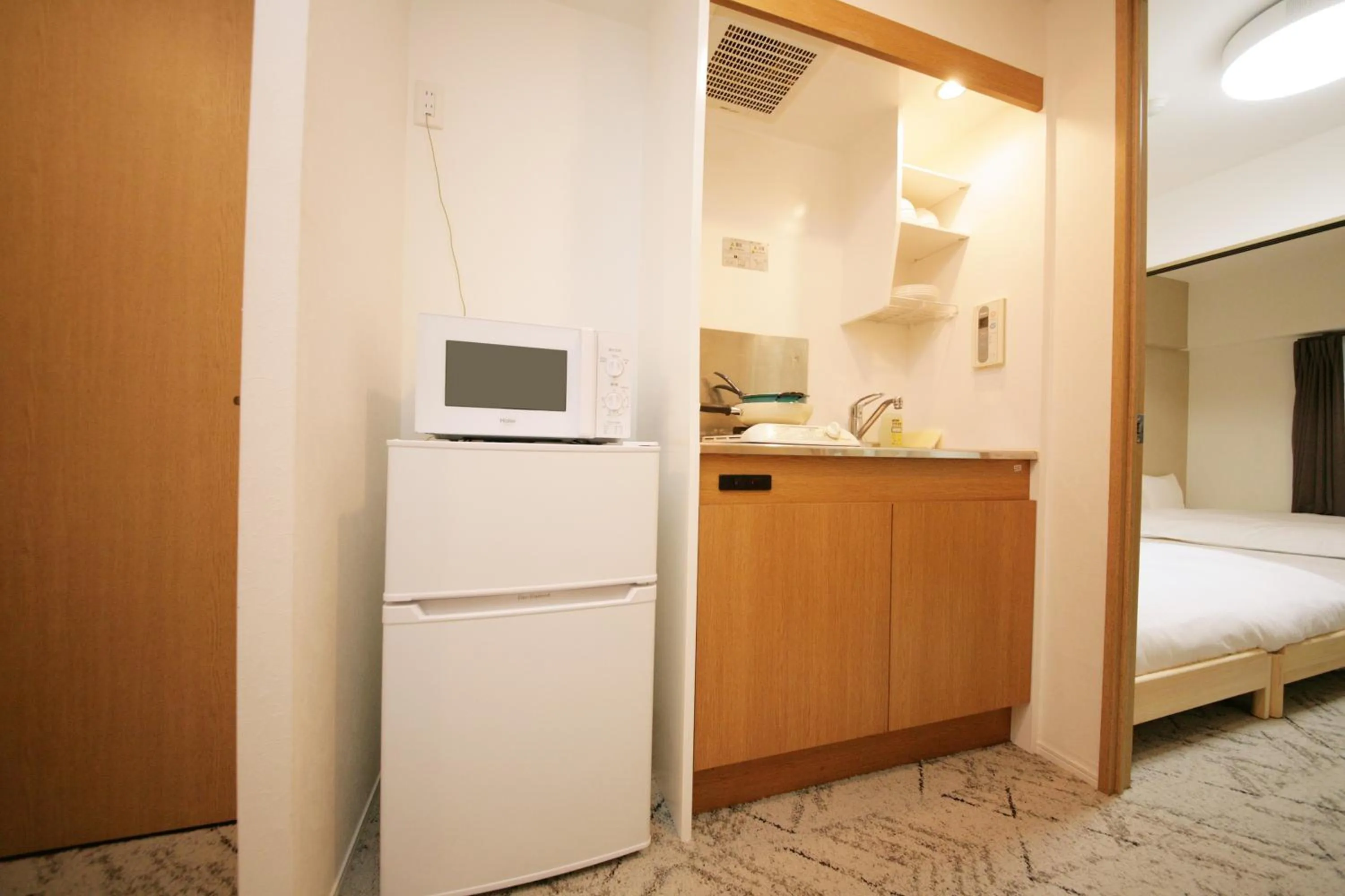 Kitchen or kitchenette, Bed in goom Hotel Fukuoka-Tenjin