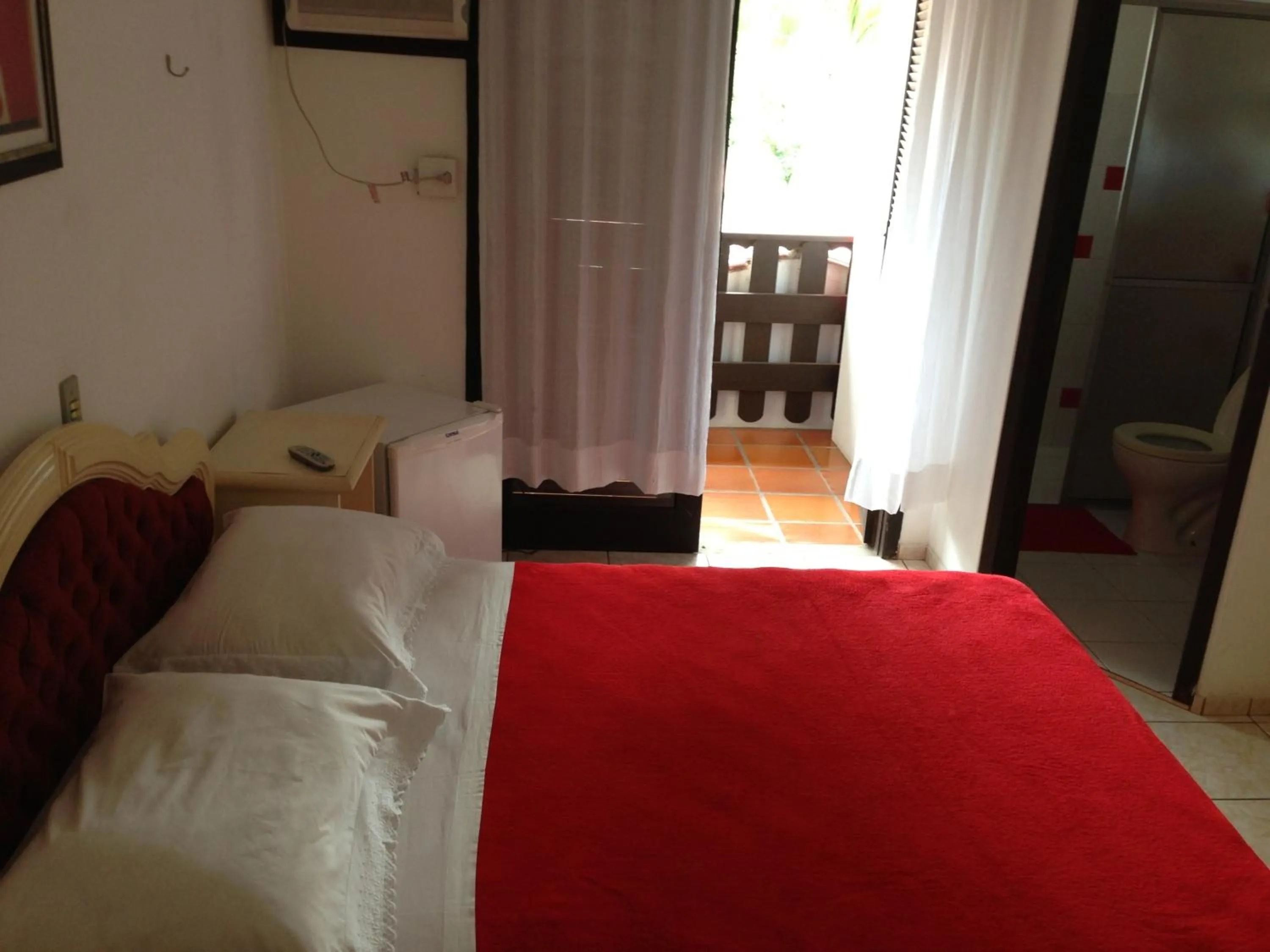 Photo of the whole room, Bed in Pousada Vila D' Itália