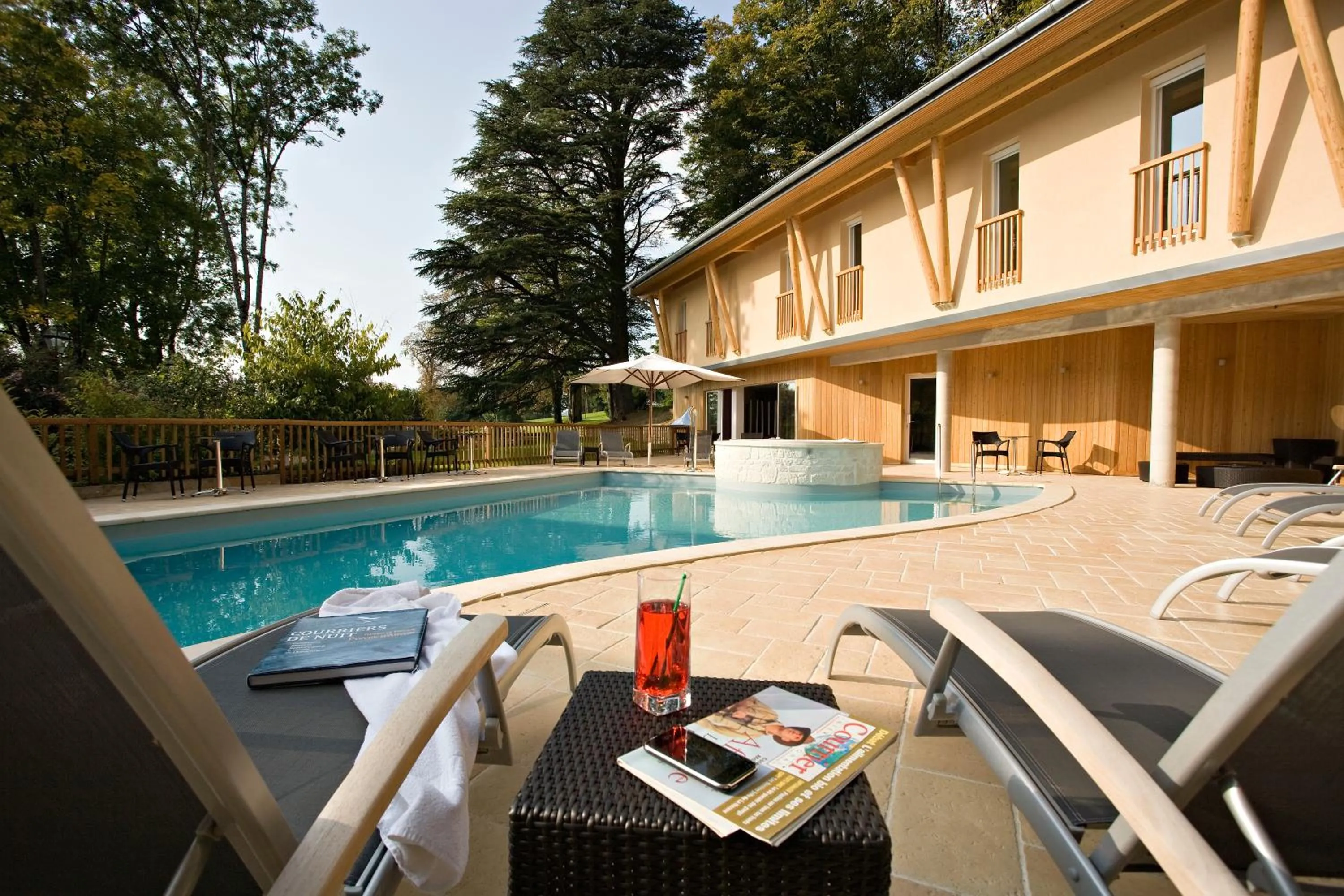 Swimming pool in Logis Hôtel Parenthèse, Restaurant & Spa