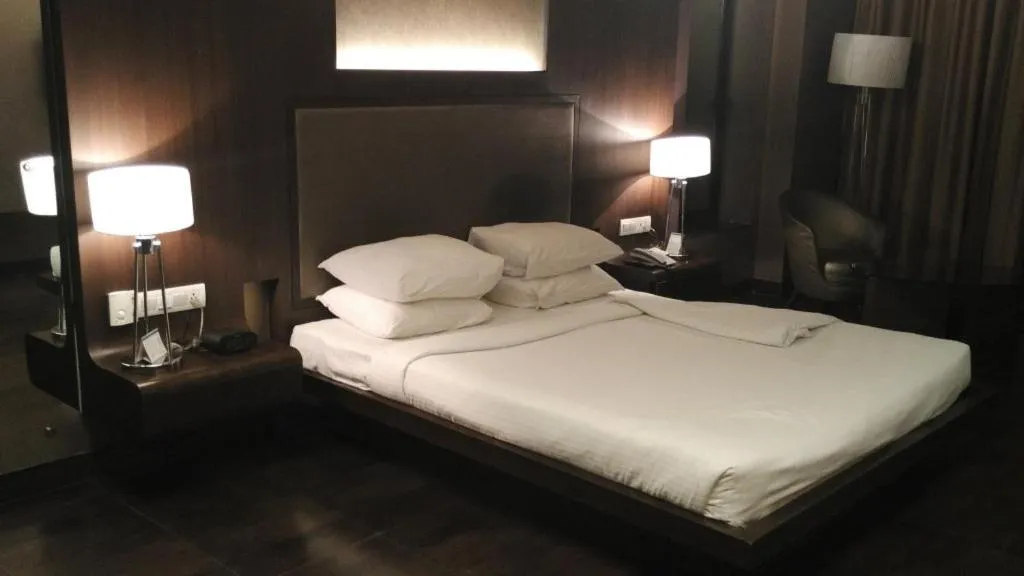 Bed in Cocoon Luxury Business Hotel