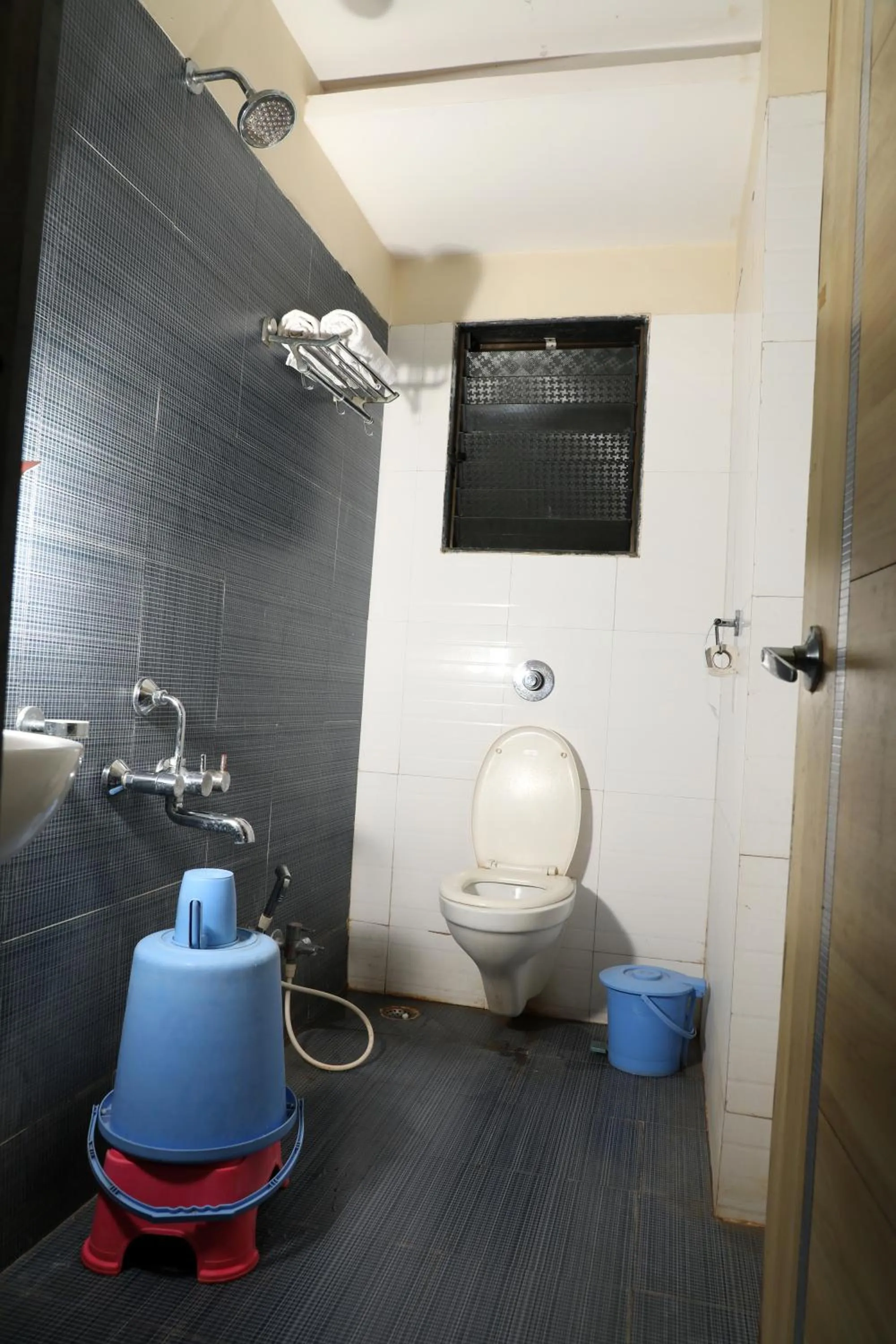 Toilet in Hotel Sai Grand Castle Inn