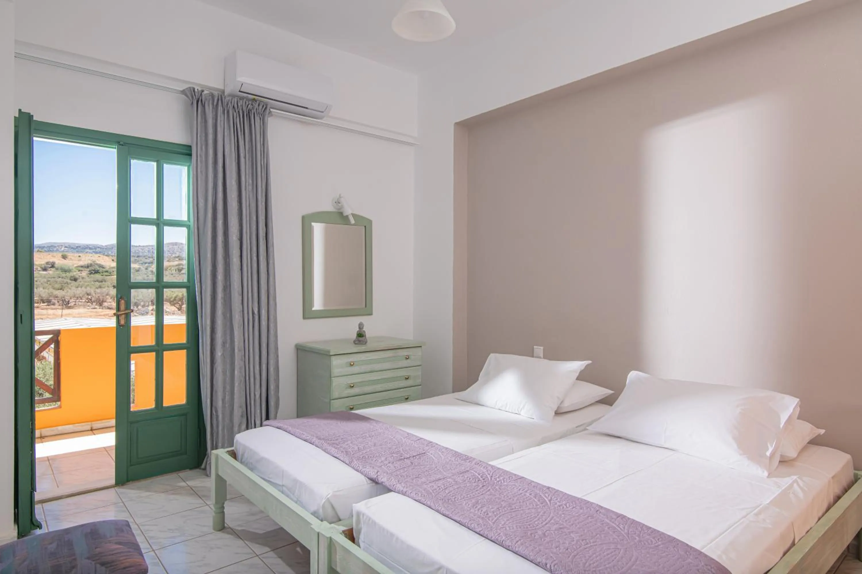 Bed in Portokali Apartments