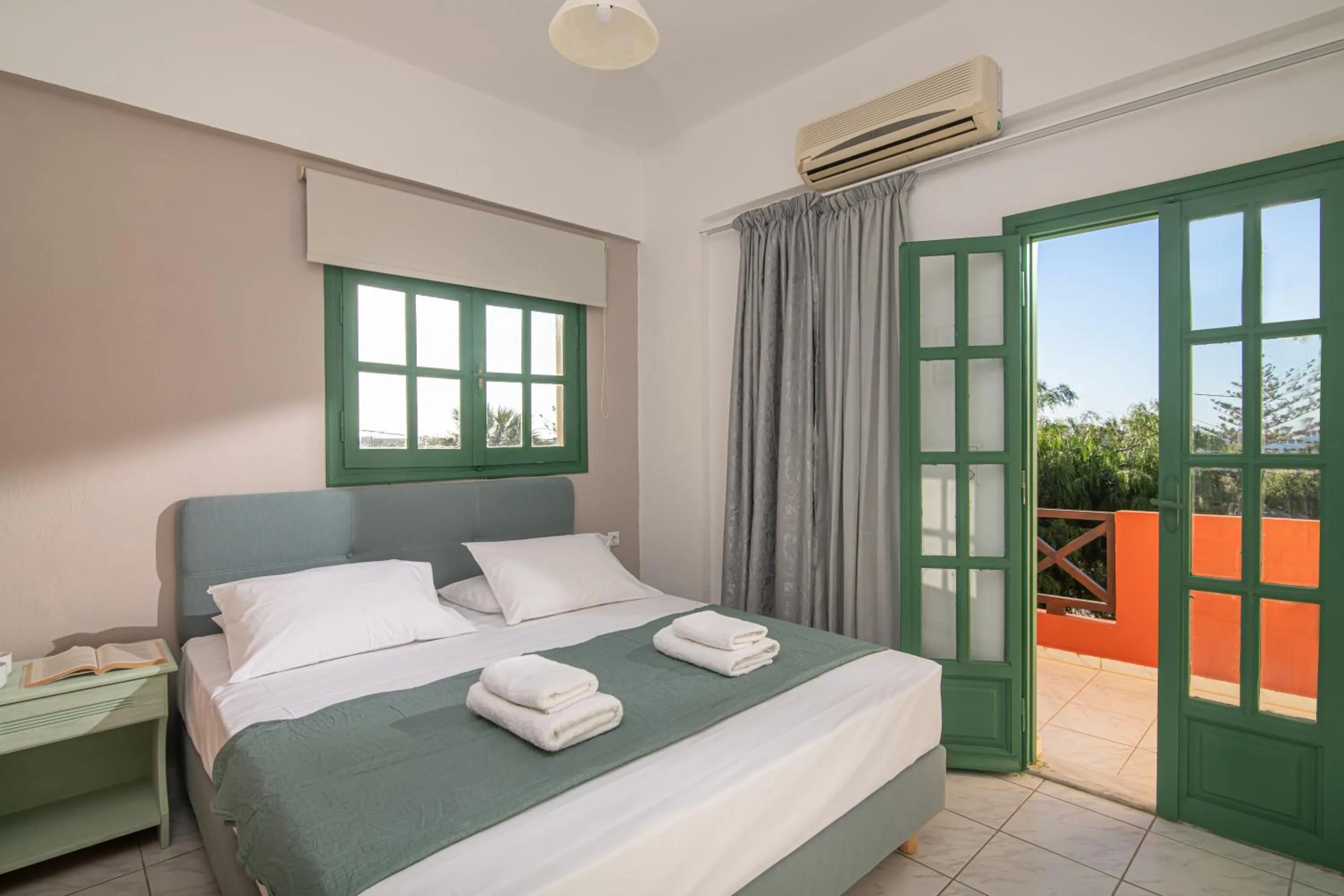 Bed in Portokali Apartments