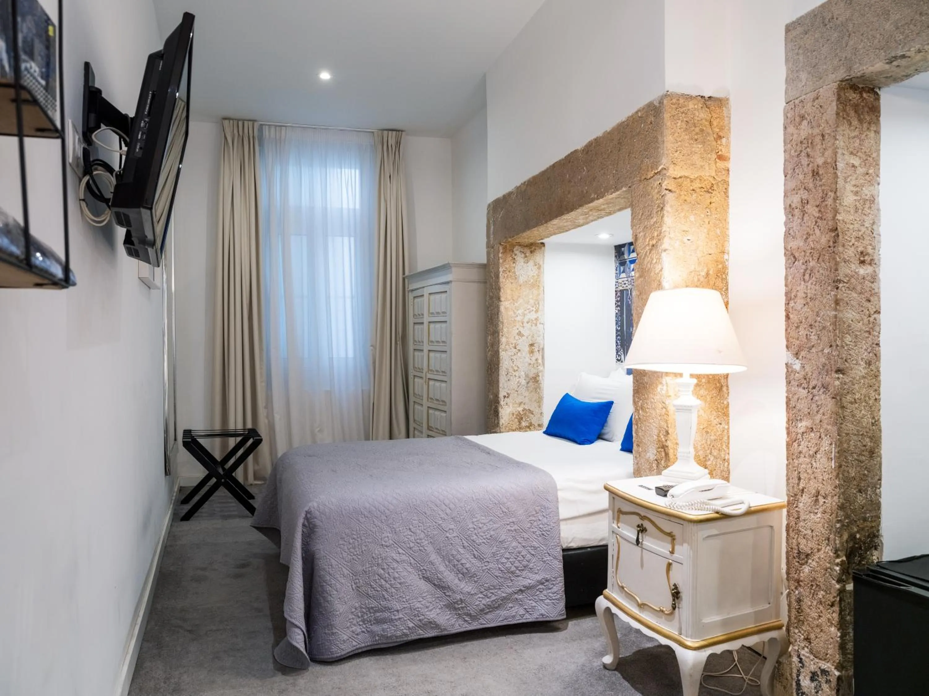 Bed in The ART INN Lisbon