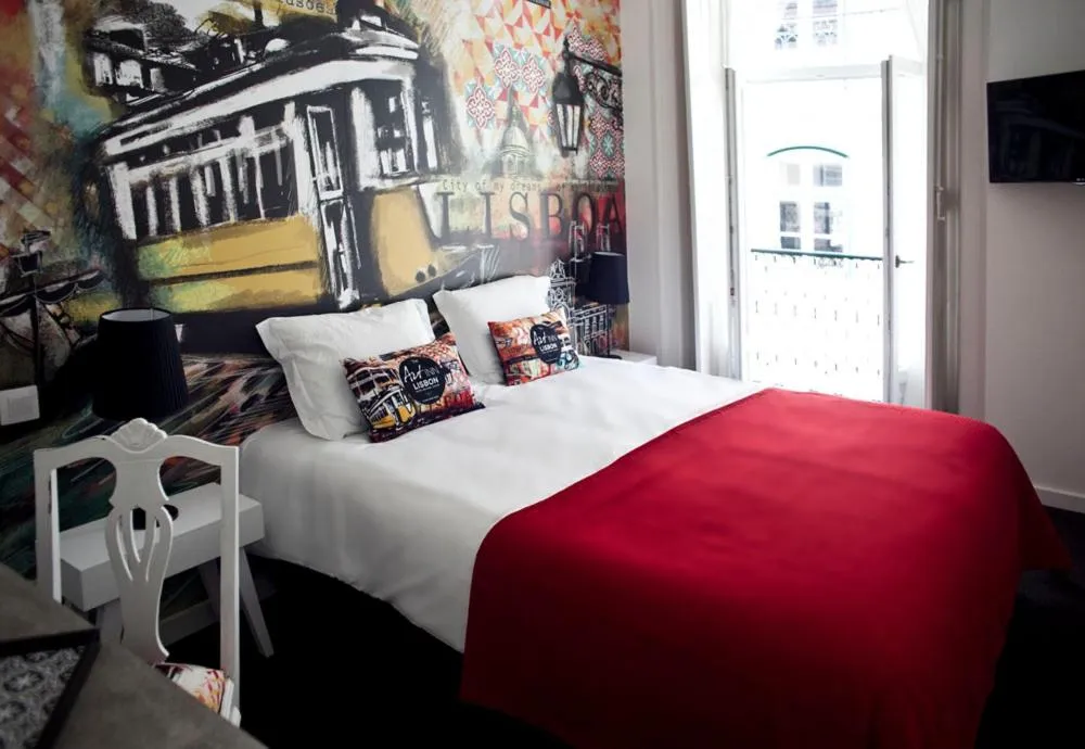 Bed in The ART INN Lisbon