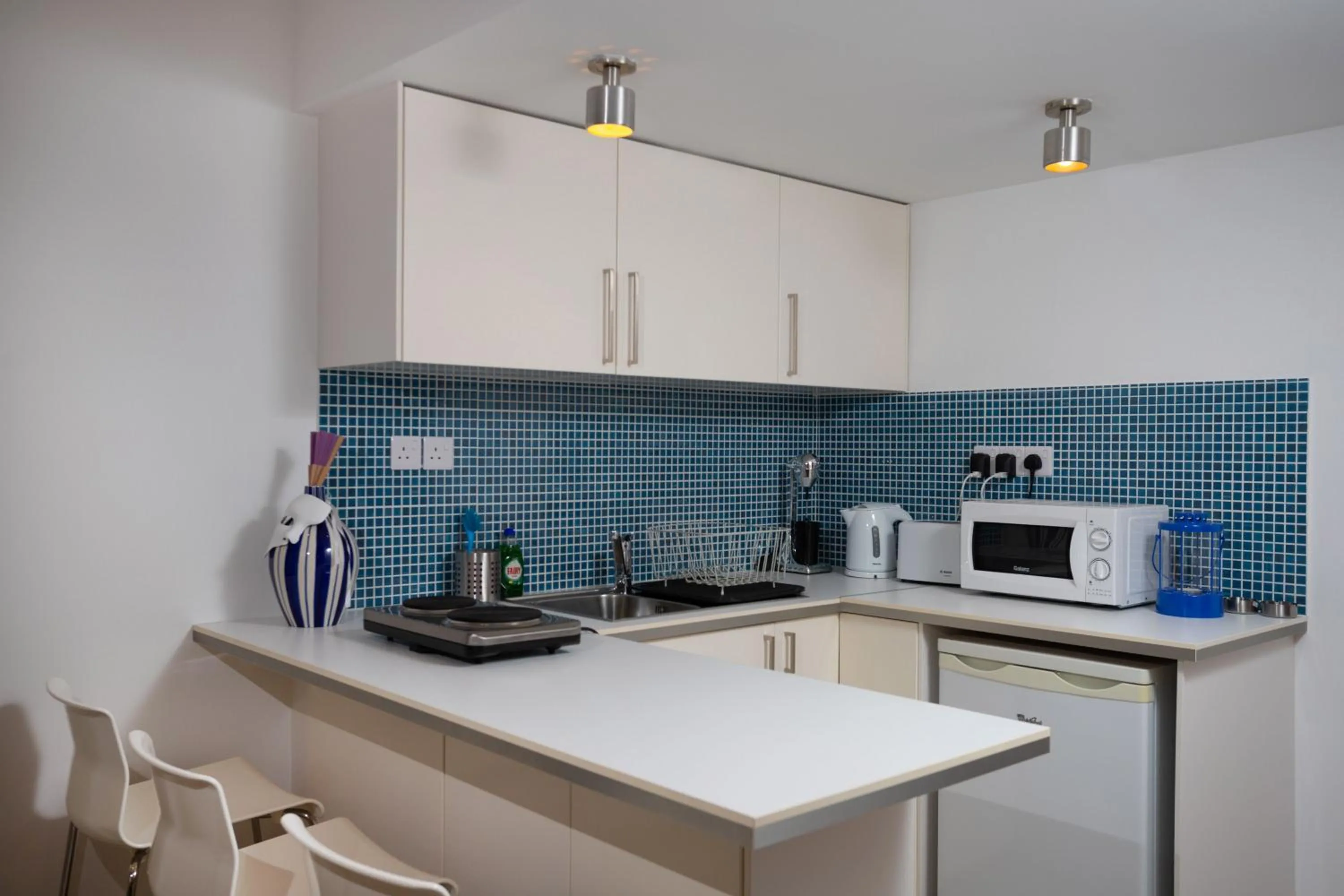 Kitchen or kitchenette in Athenaeum Beachside Apt by TrulyCyprus