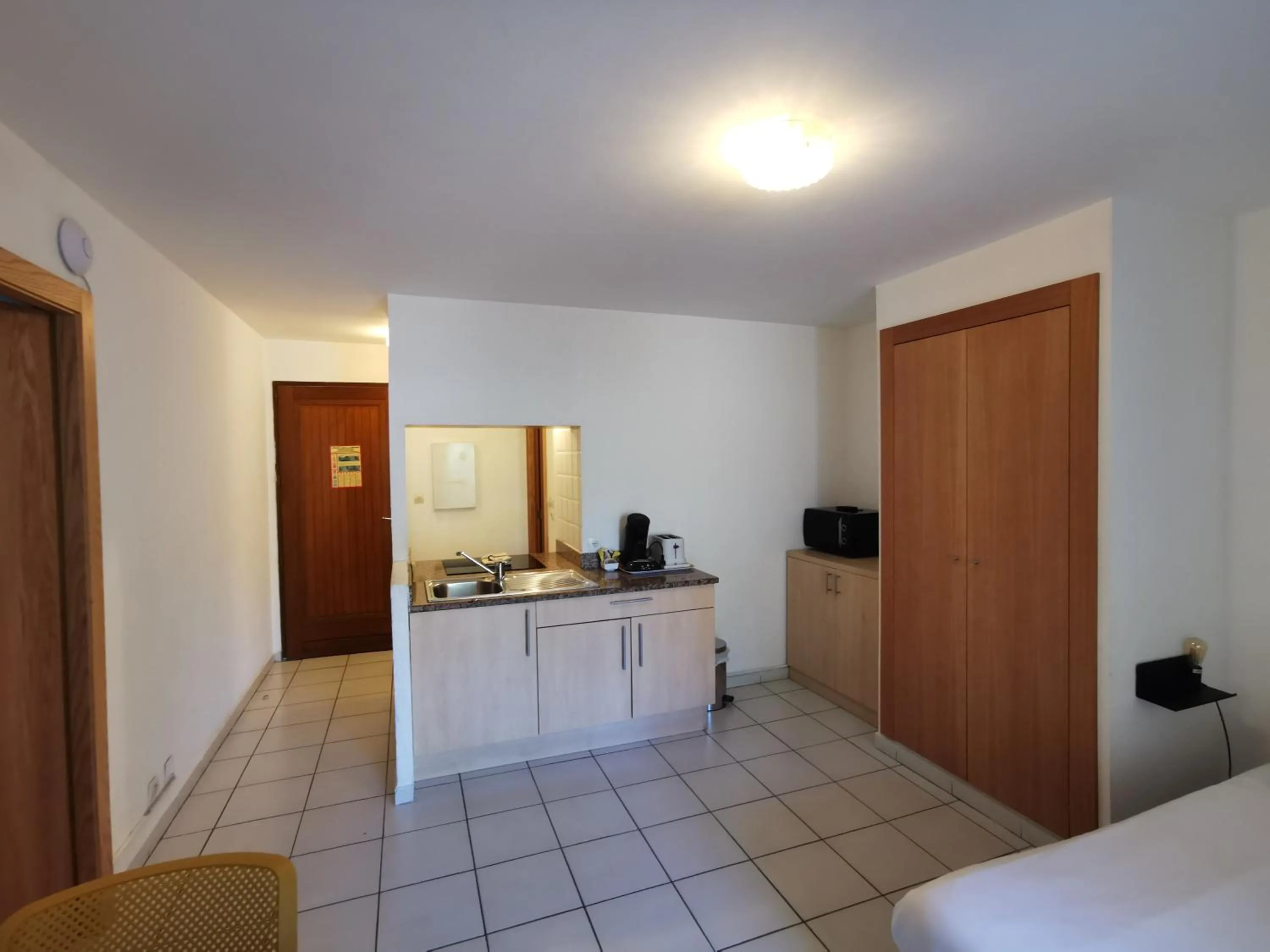 Kitchen or kitchenette, Bed in Résidence Saint Michel