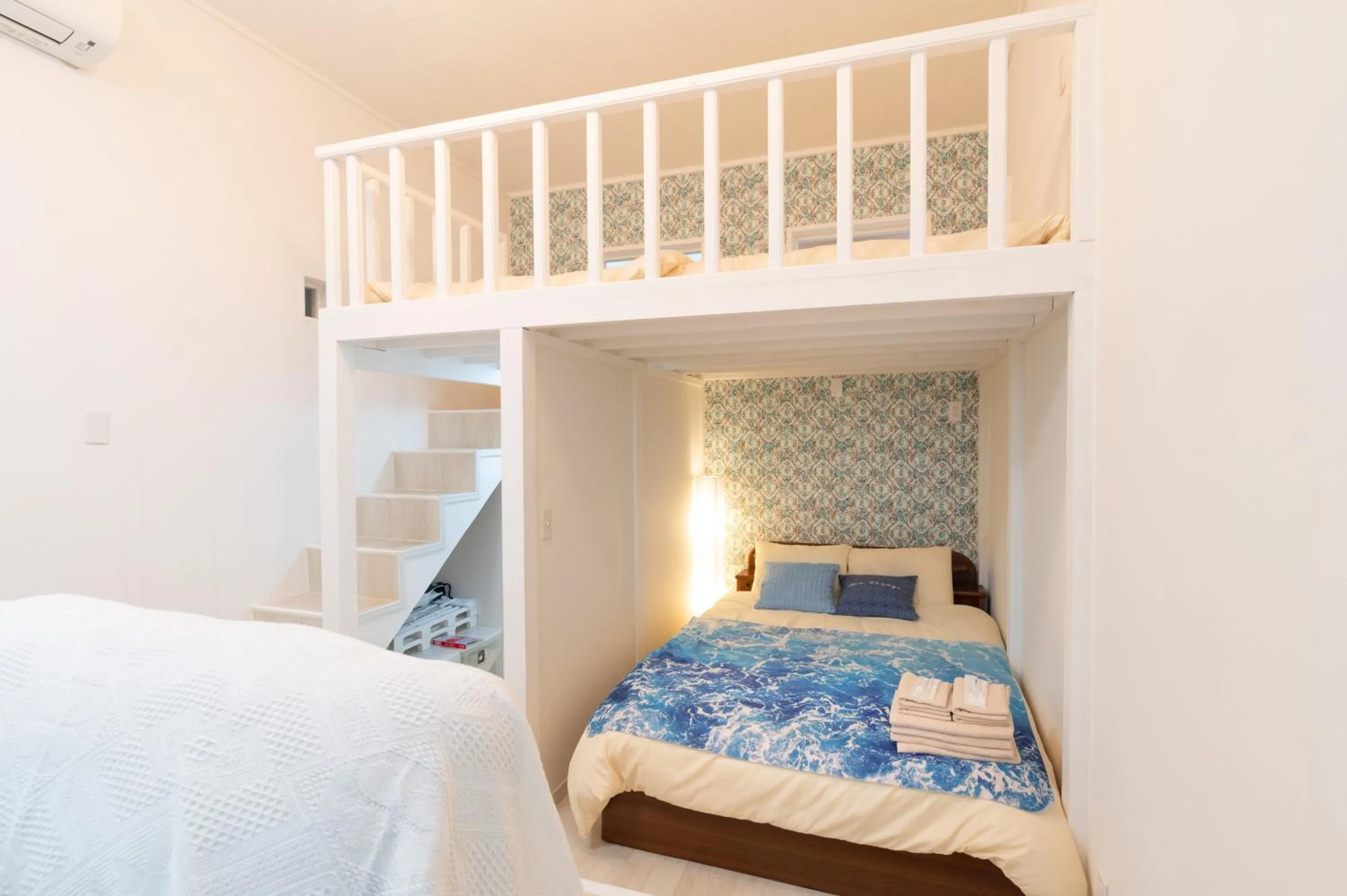 Bedroom, Bed in Maximum of 21 people can be rented in one building 3 minutes walk to Tomari Port 10 minutes drive to the airport No parking lot 30 seconds walk from paid parking lot warayunso port city May