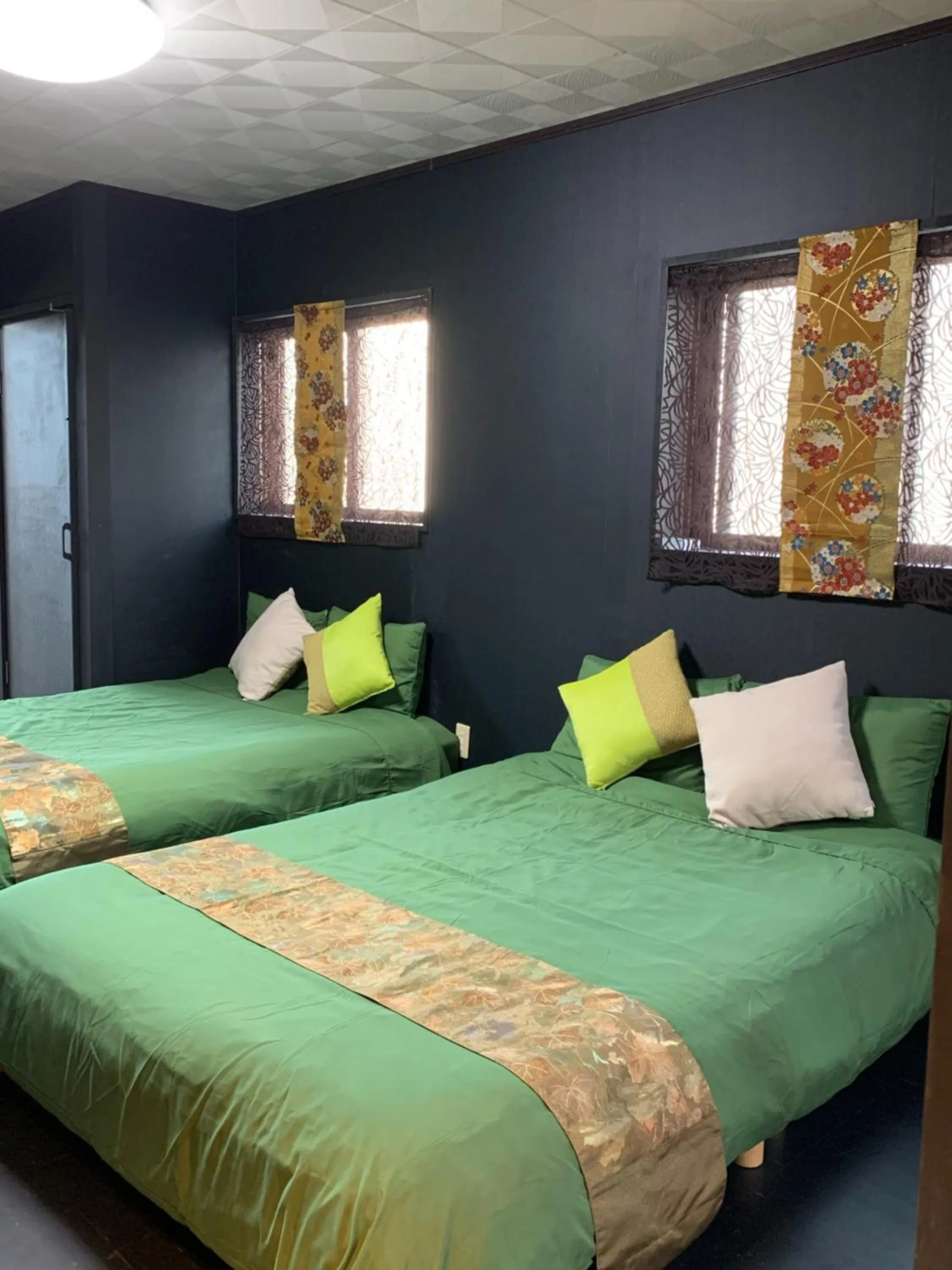 Bedroom, Bed in Maximum of 21 people can be rented in one building 3 minutes walk to Tomari Port 10 minutes drive to the airport No parking lot 30 seconds walk from paid parking lot warayunso port city May
