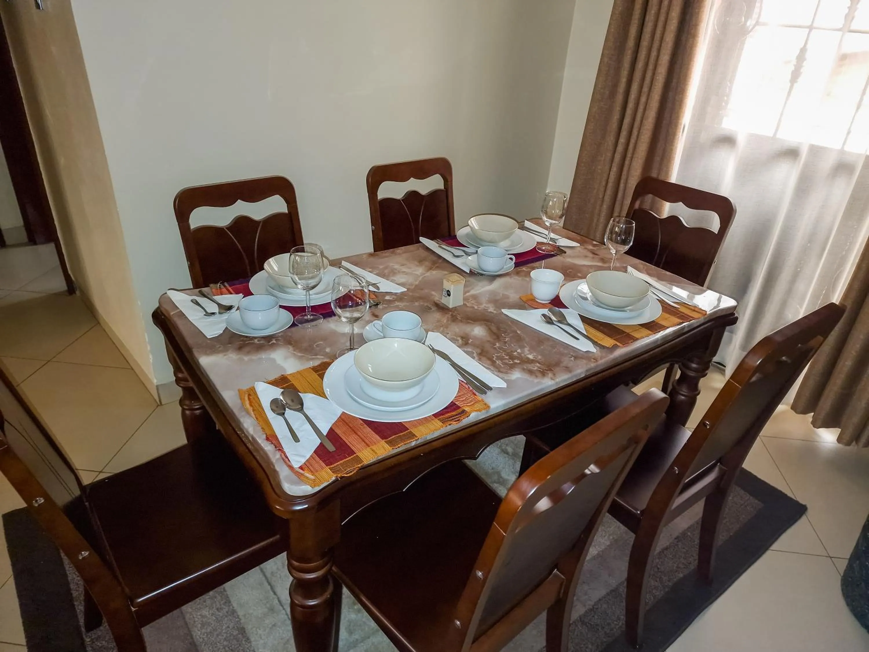 Dining area, Bed in Eric Wilkins Apartments