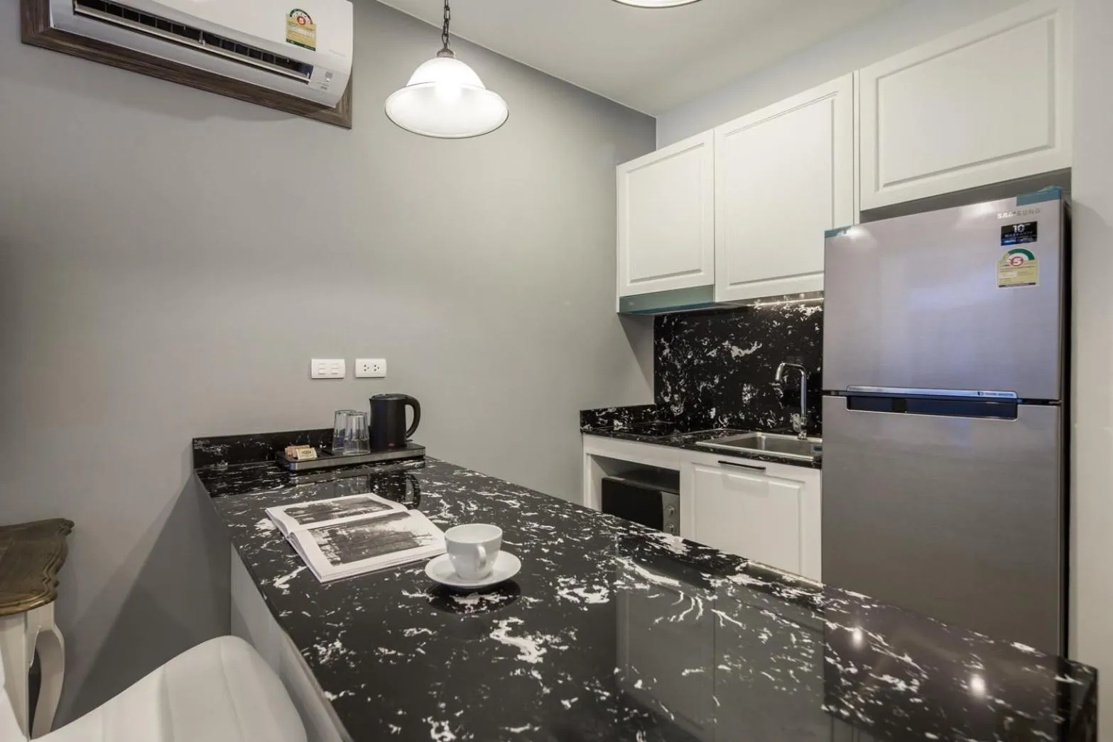 Kitchen or kitchenette in Palmyrah Surin Beach Residence