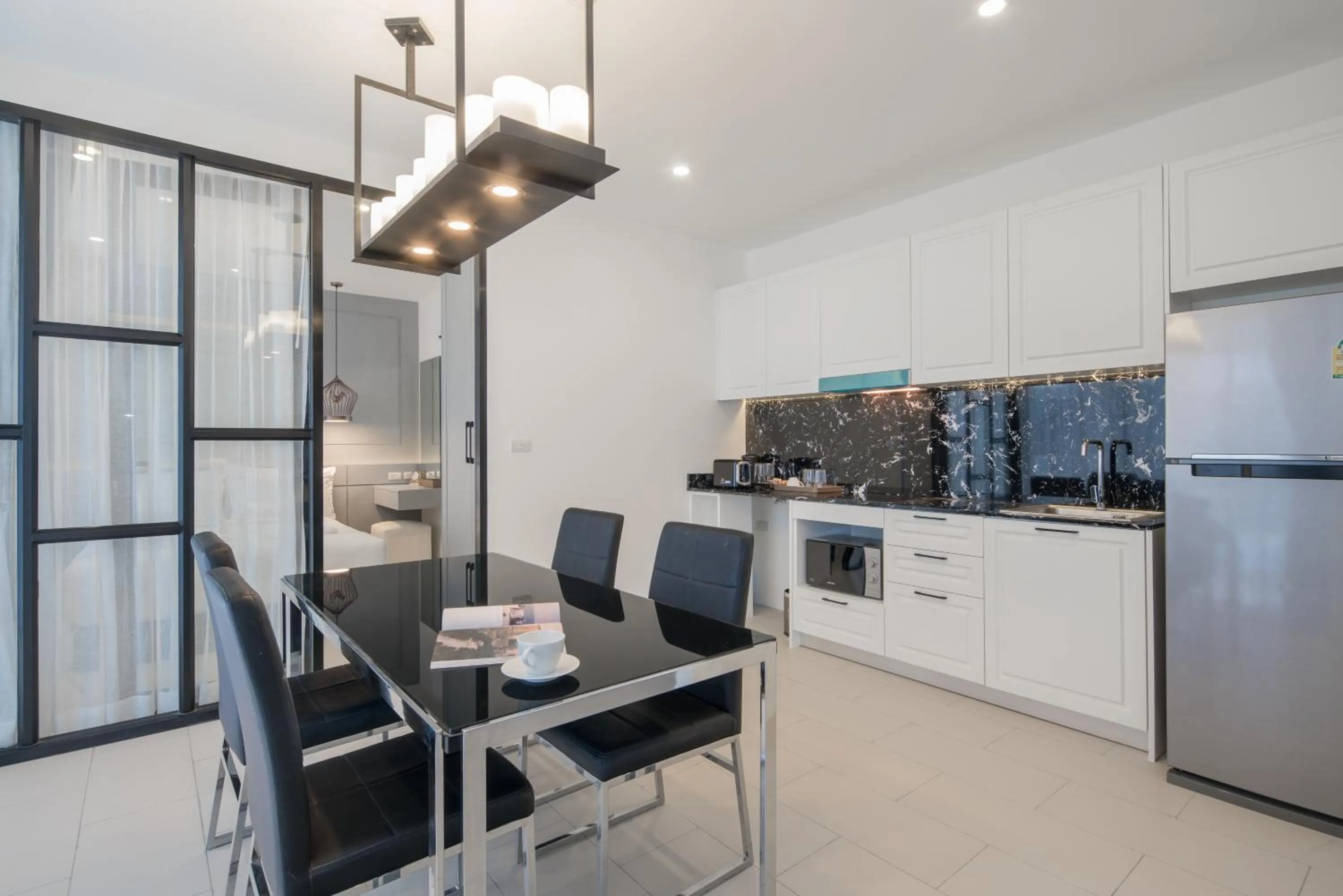 Kitchen or kitchenette in Palmyrah Surin Beach Residence