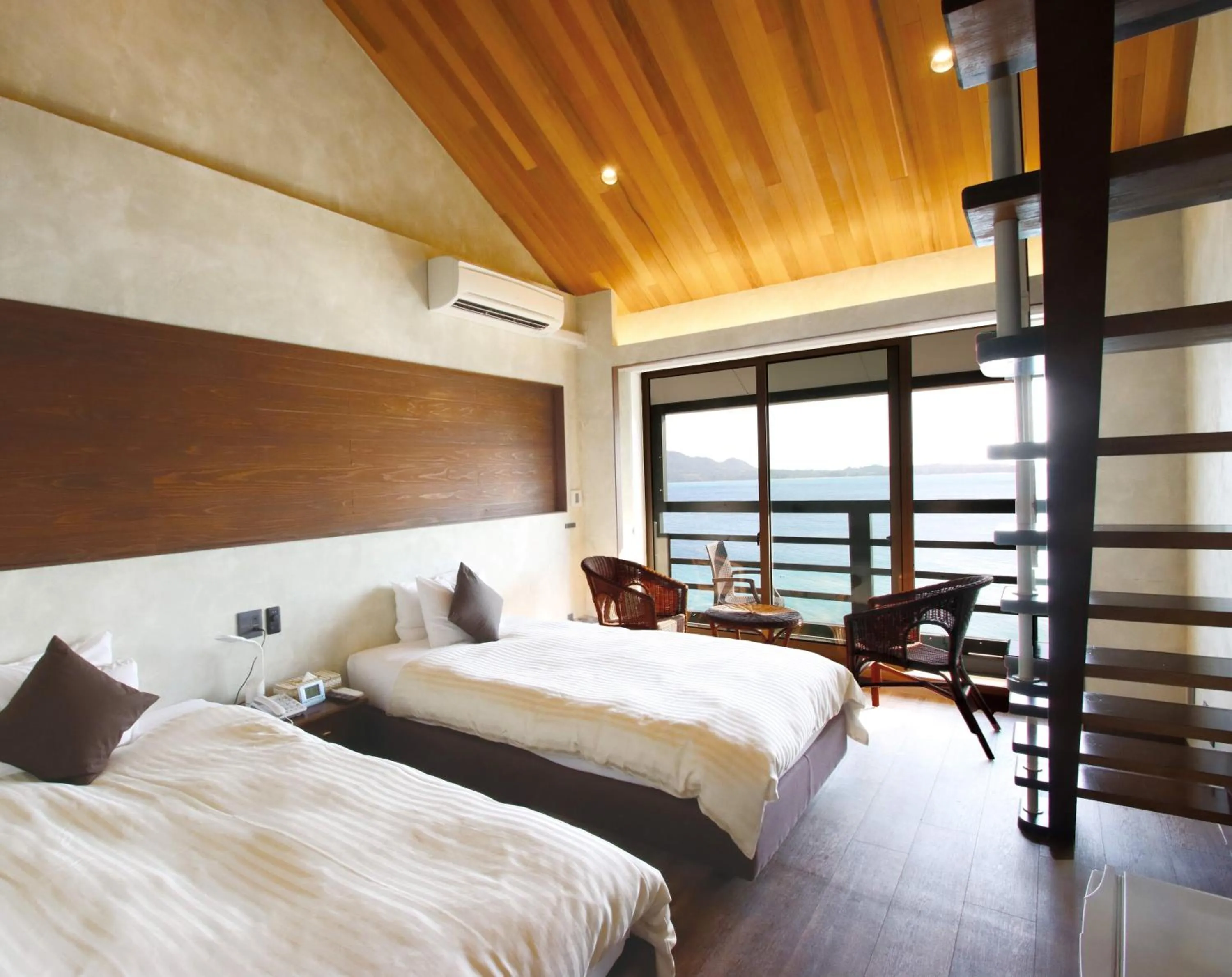 Bed in Petit Resort Native Sea Amami