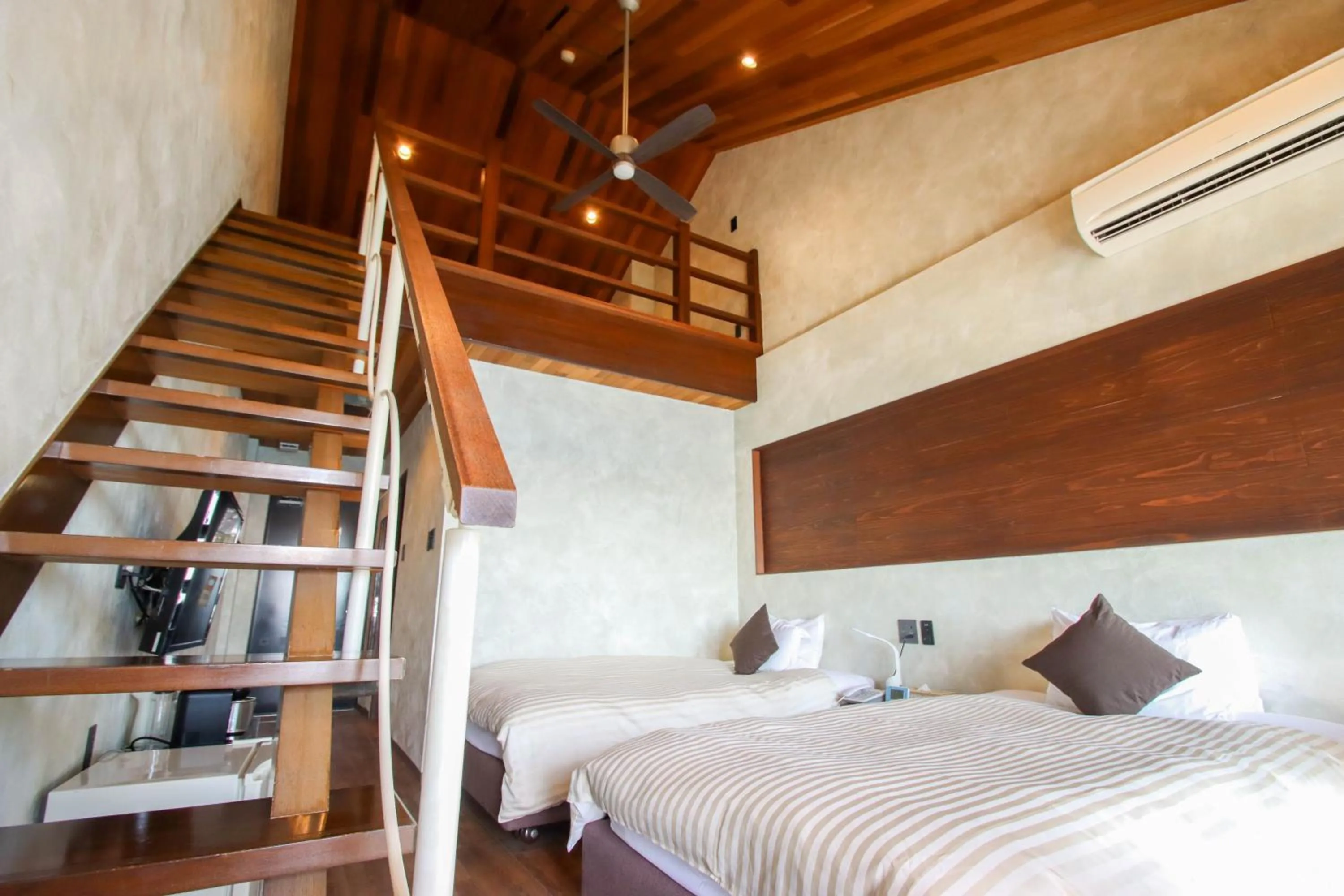 Bed in Petit Resort Native Sea Amami