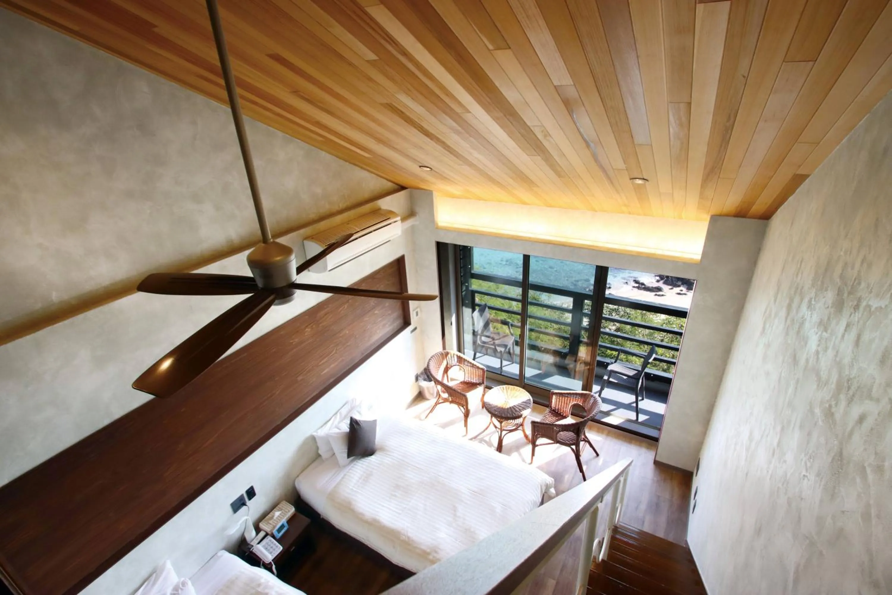 Bed in Petit Resort Native Sea Amami