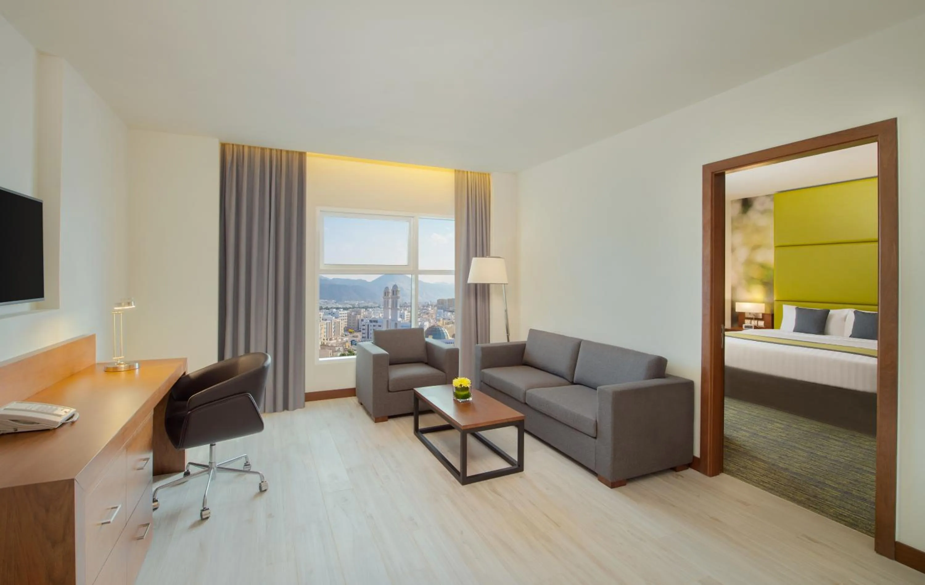 Living room, Bed in Wyndham Garden Muscat Al Khuwair