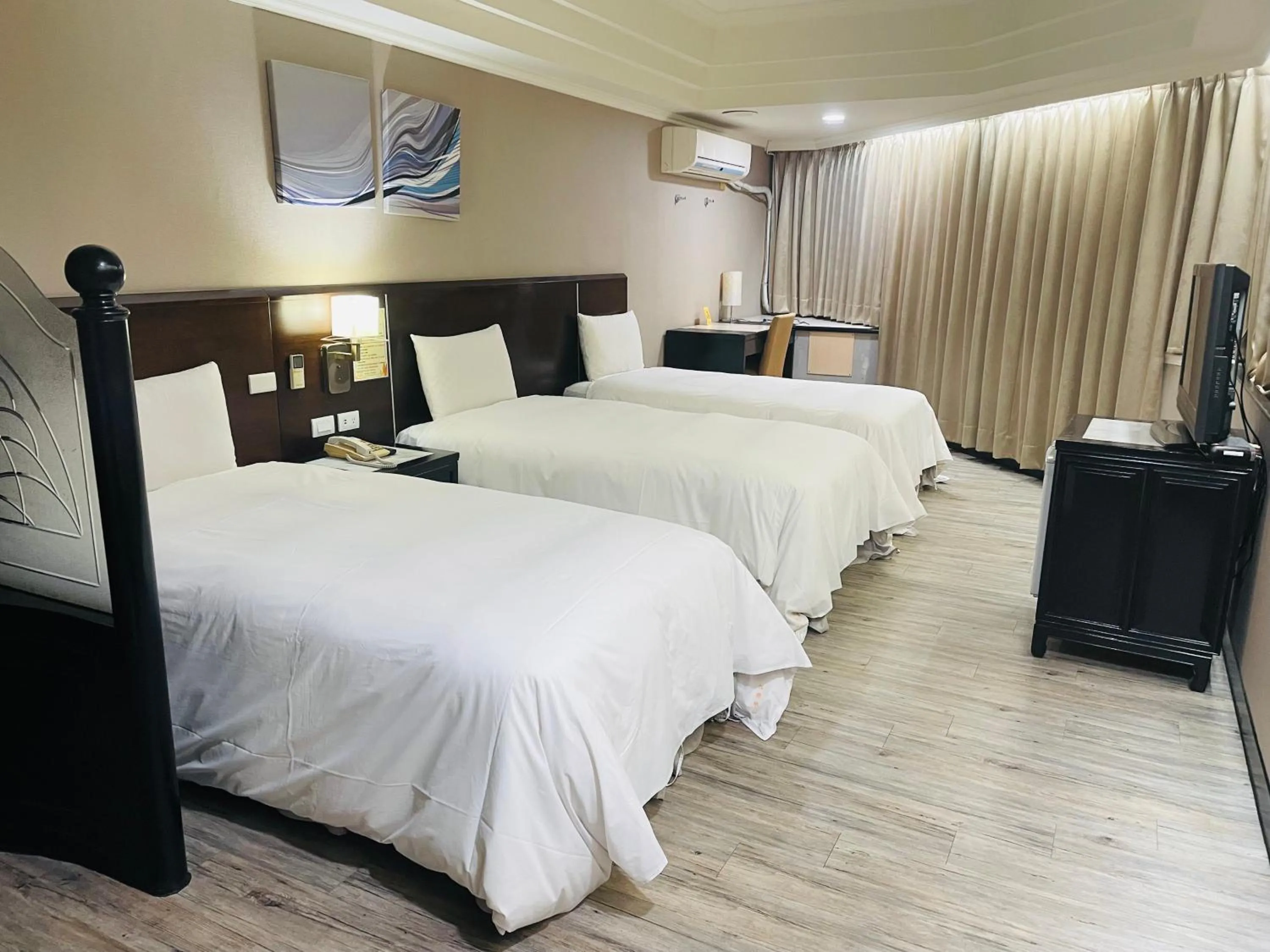 Bed in Felicity Business Hotel