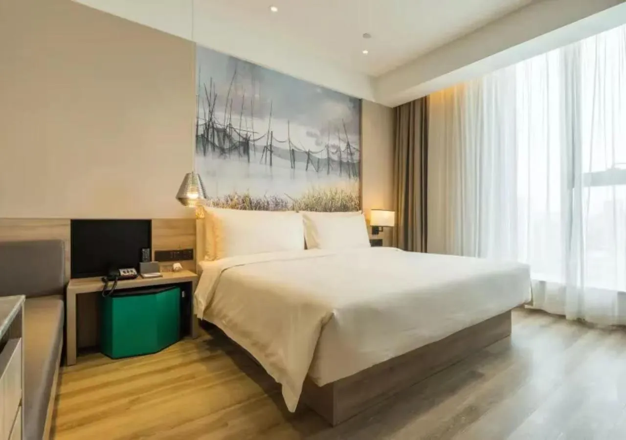 Bed in Atour Hotel Hangzhou Binjiang Jiangling Road