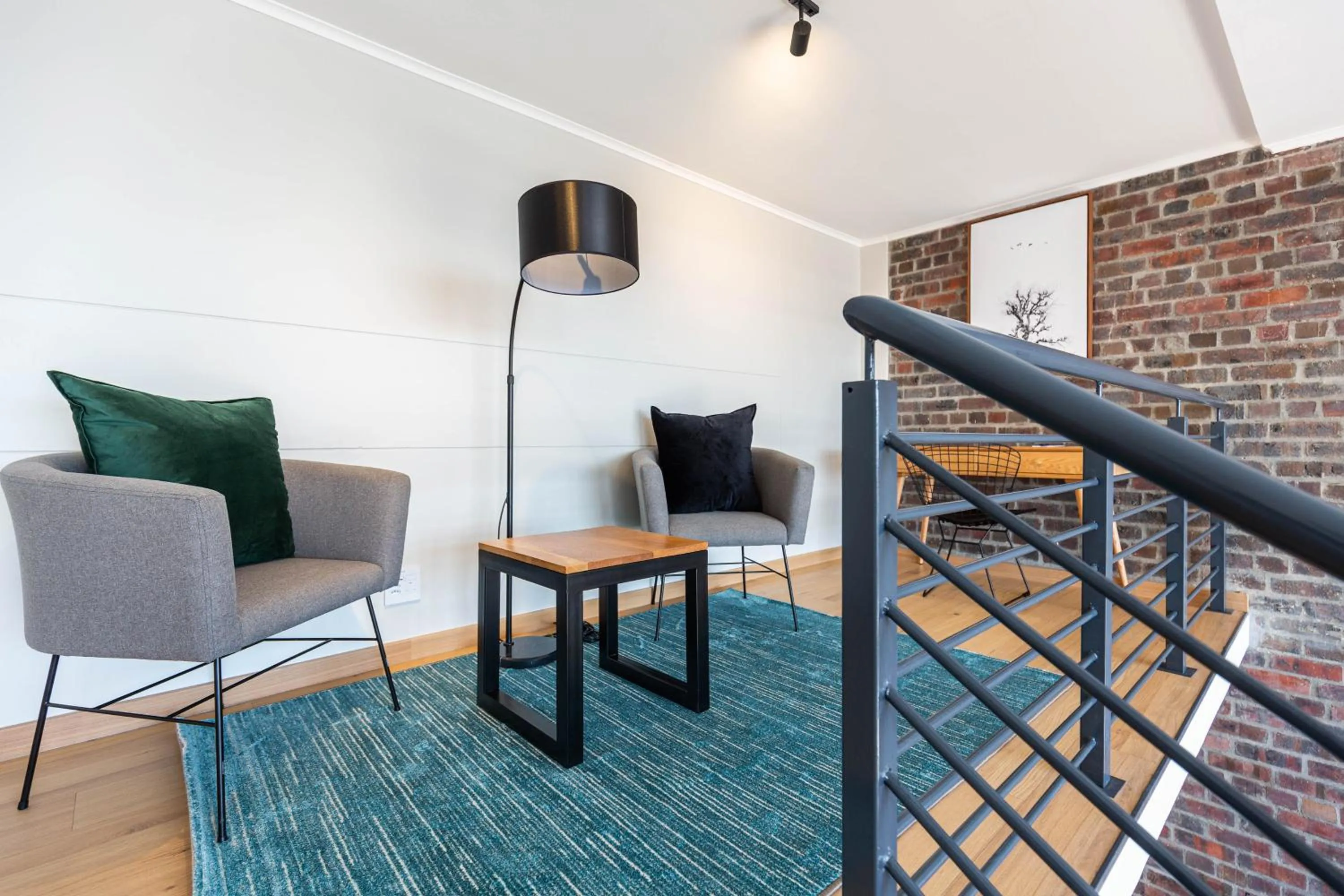 Seating area in Urban Artisan Luxury Suites by Totalstay