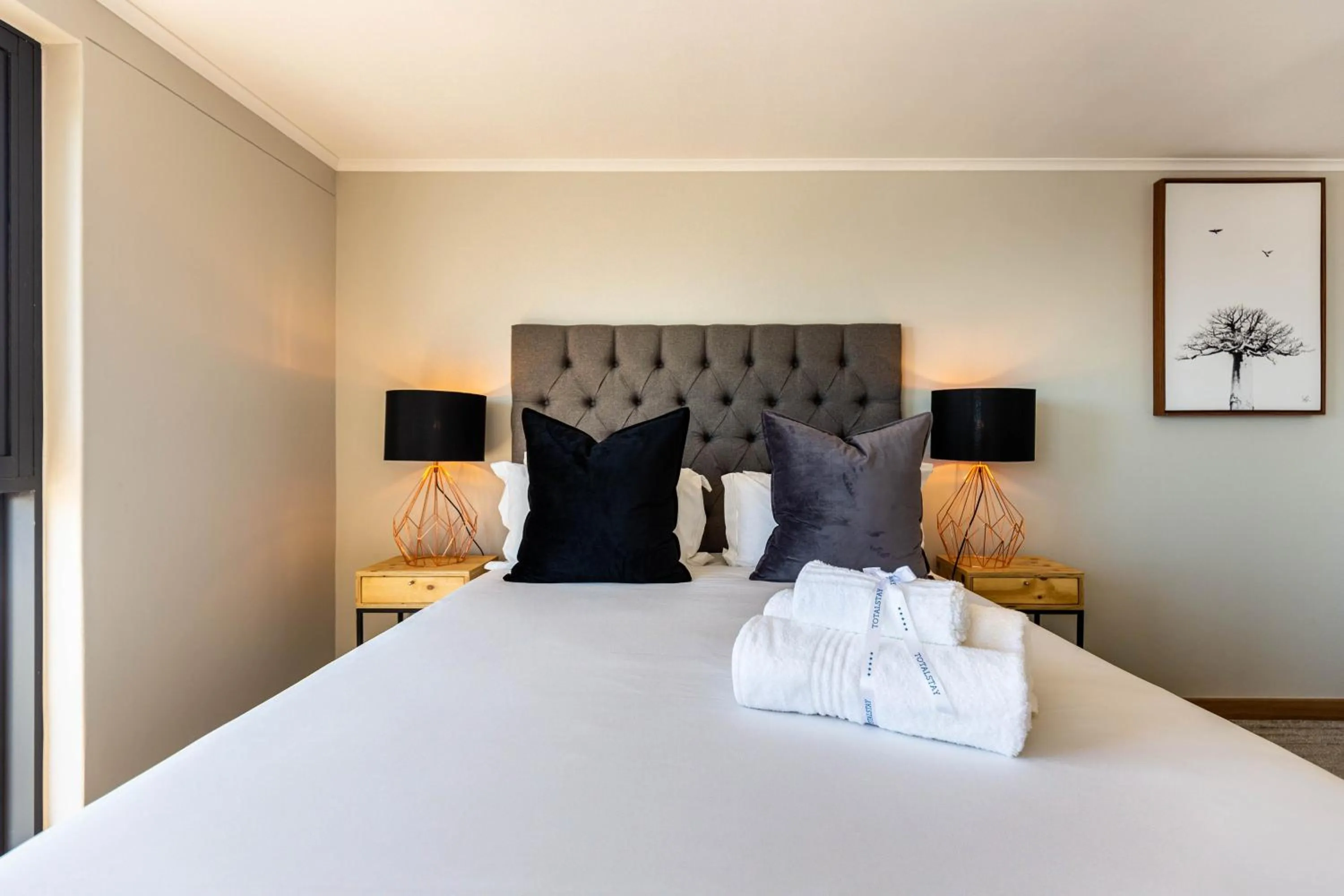 Bed in Urban Artisan Luxury Suites by Totalstay