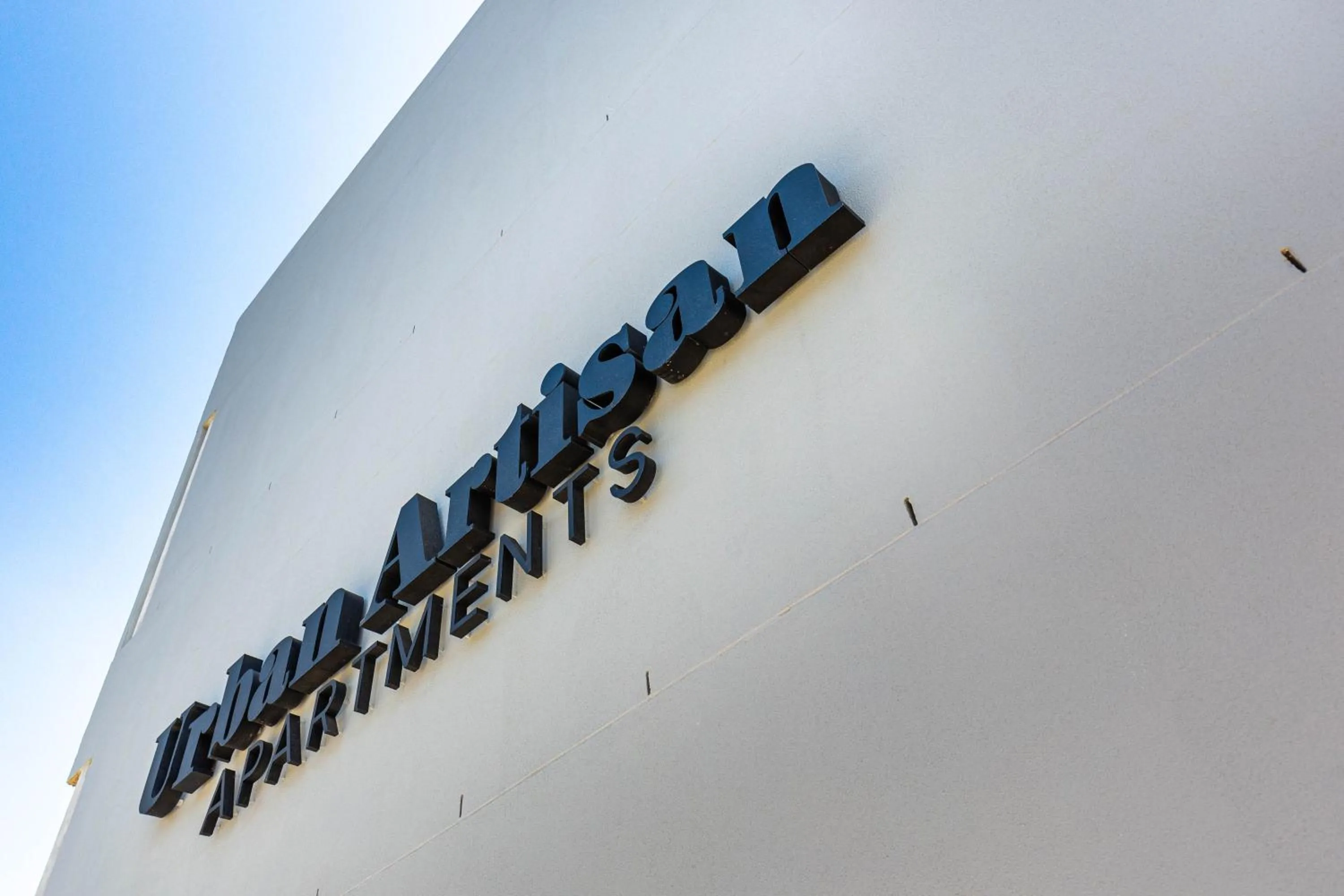 Property logo or sign in Urban Artisan Luxury Suites by Totalstay