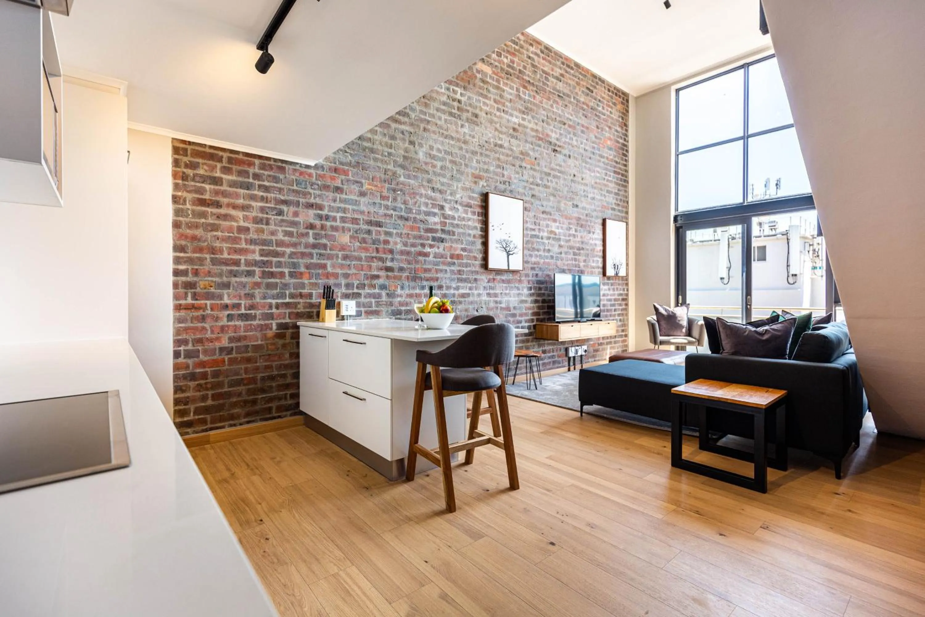 Living room in Urban Artisan Luxury Suites by Totalstay