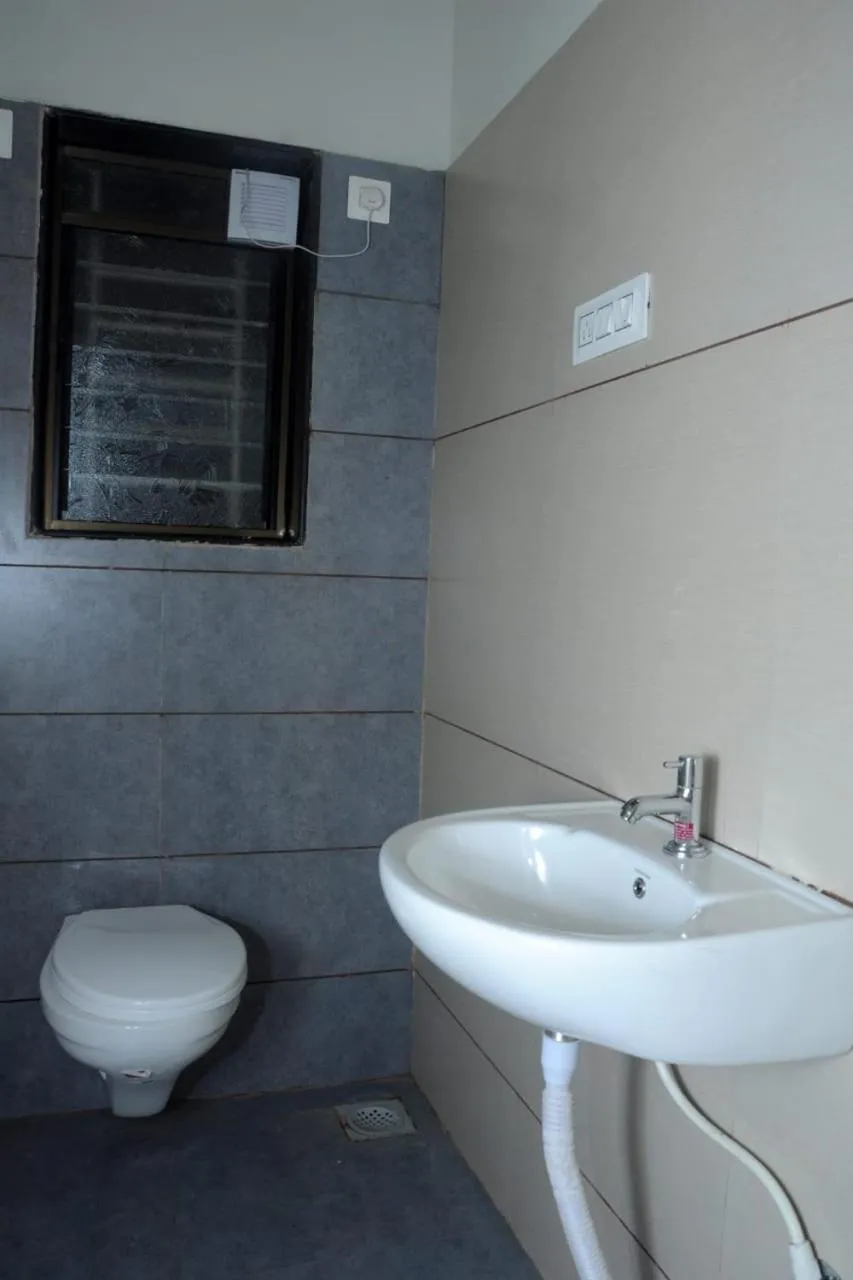 Toilet in Rutu's Holidays Resort Panhala