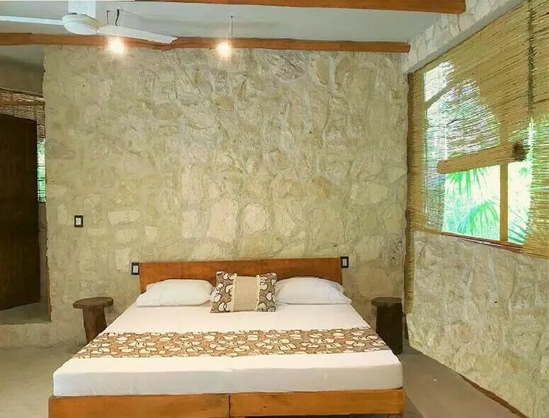 Bed in Aldea Maya-Ha Cabañas con cenotes