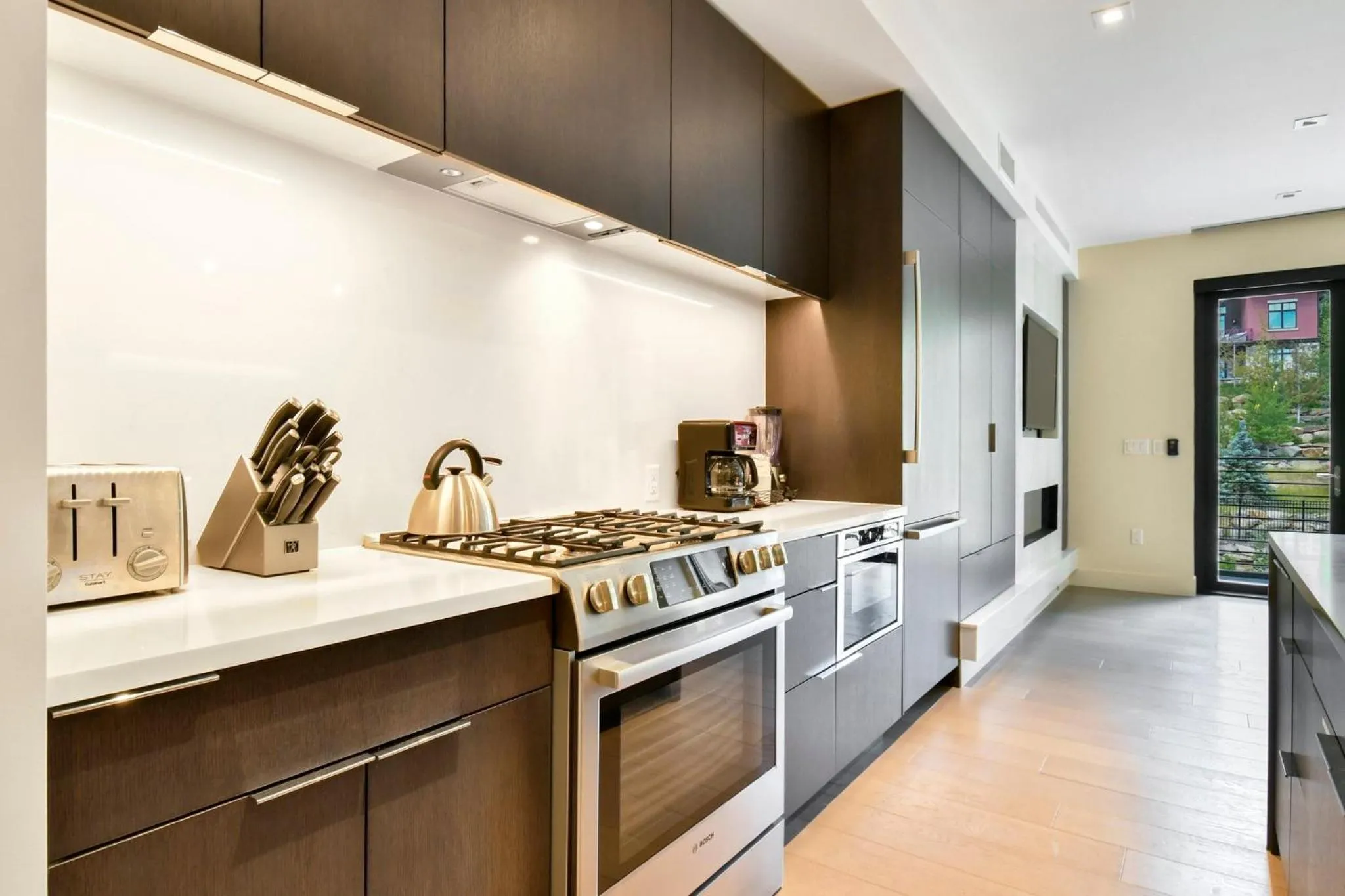 Communal kitchen in Lift Park City Condominiums by Vail Resorts